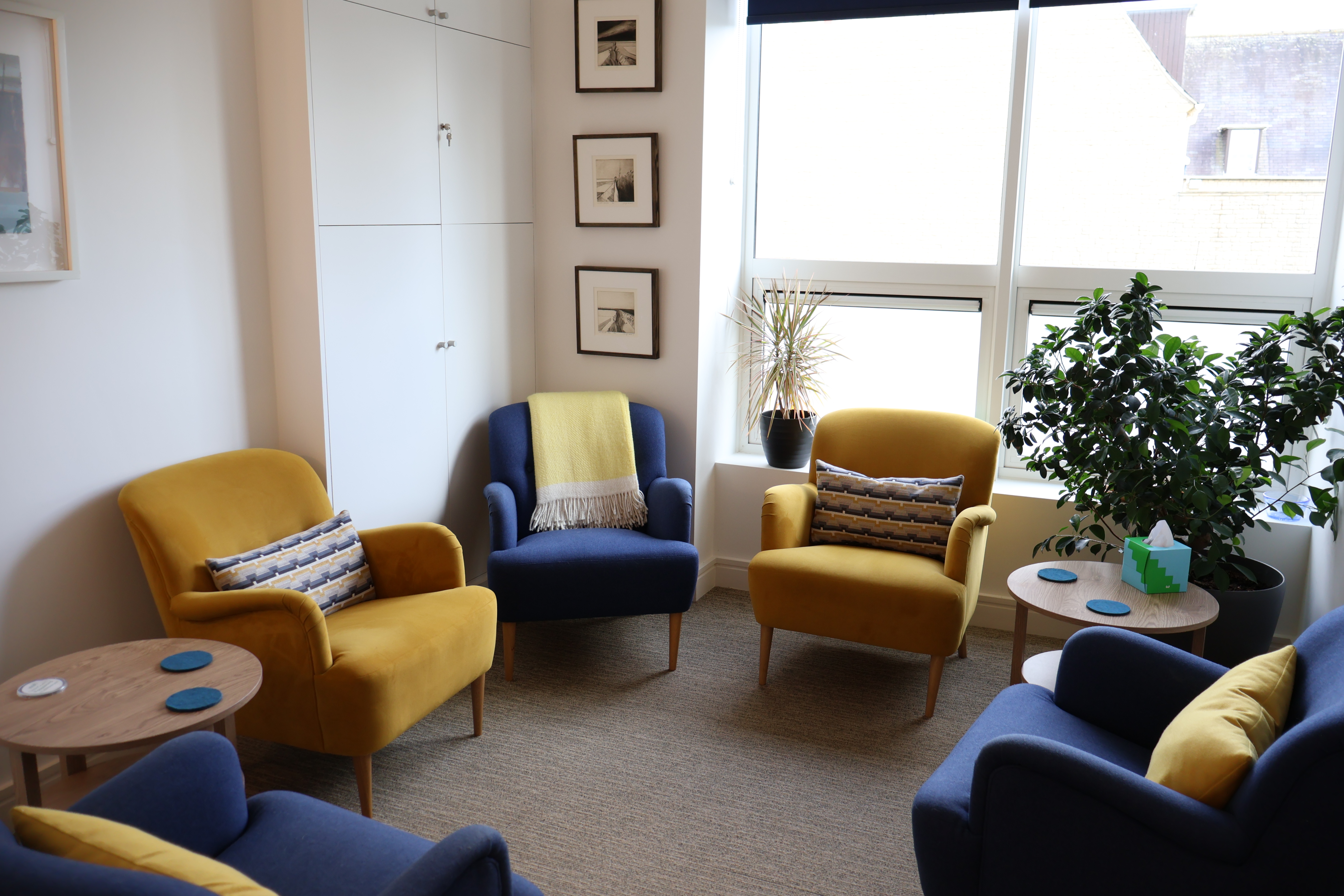 Cozy Oasis Studio meeting space with natural light for brainstorming and collaboration.