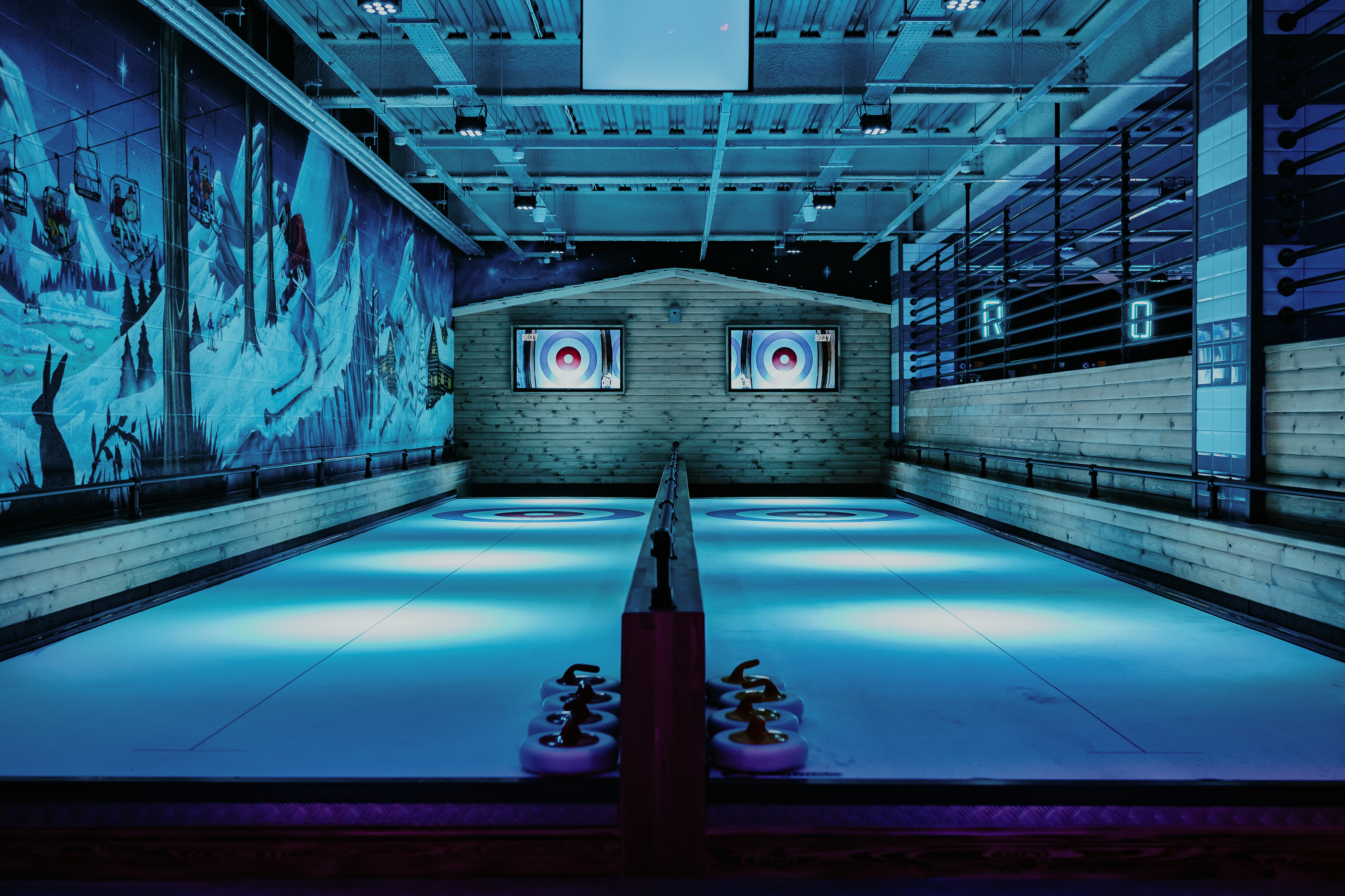 Ice curling rink at The Lodge, Cheltenham for corporate winter events and team-building.