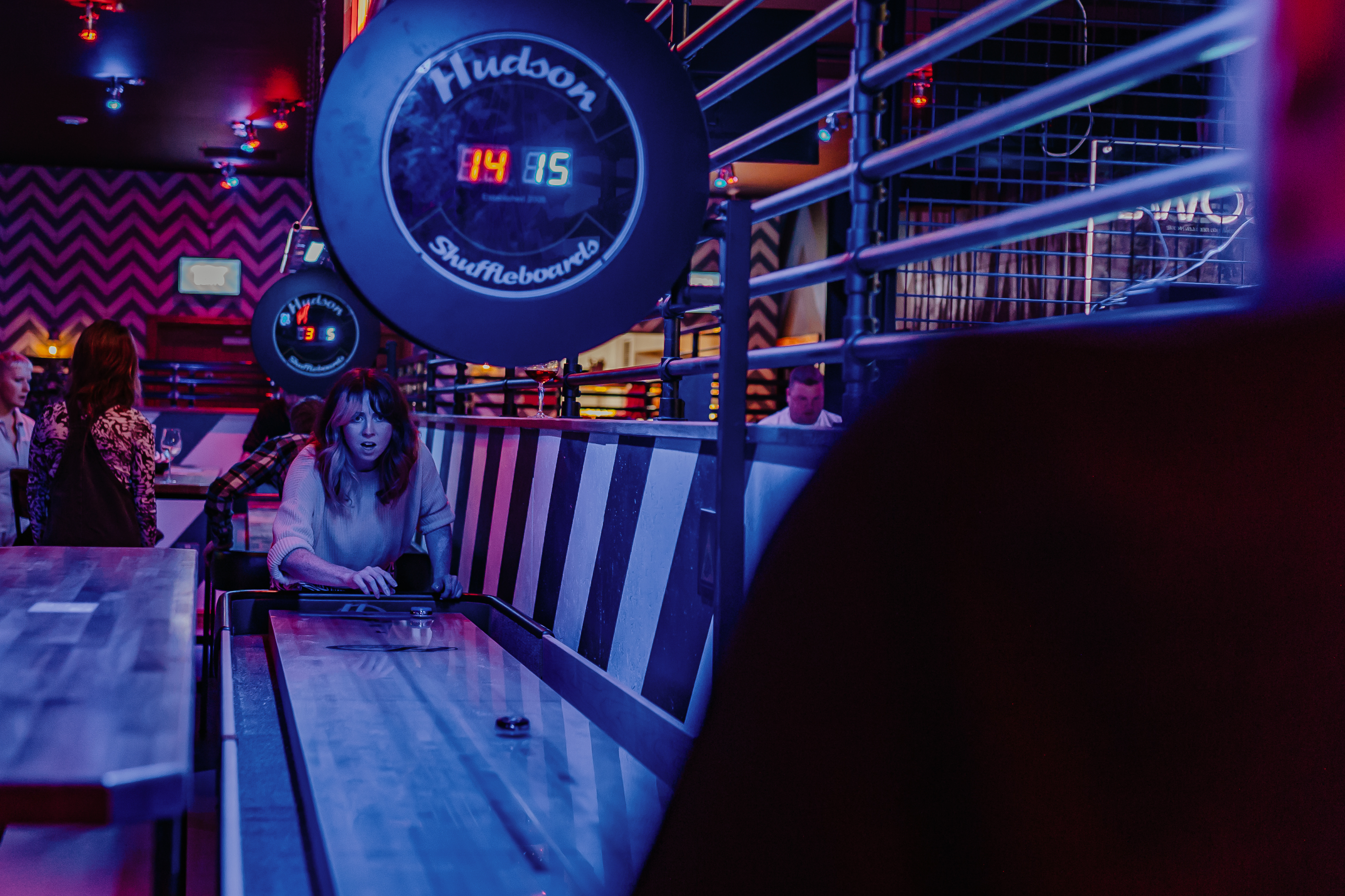 Roxy Lanes Tournament Area with shuffleboard, perfect for team-building and networking events.