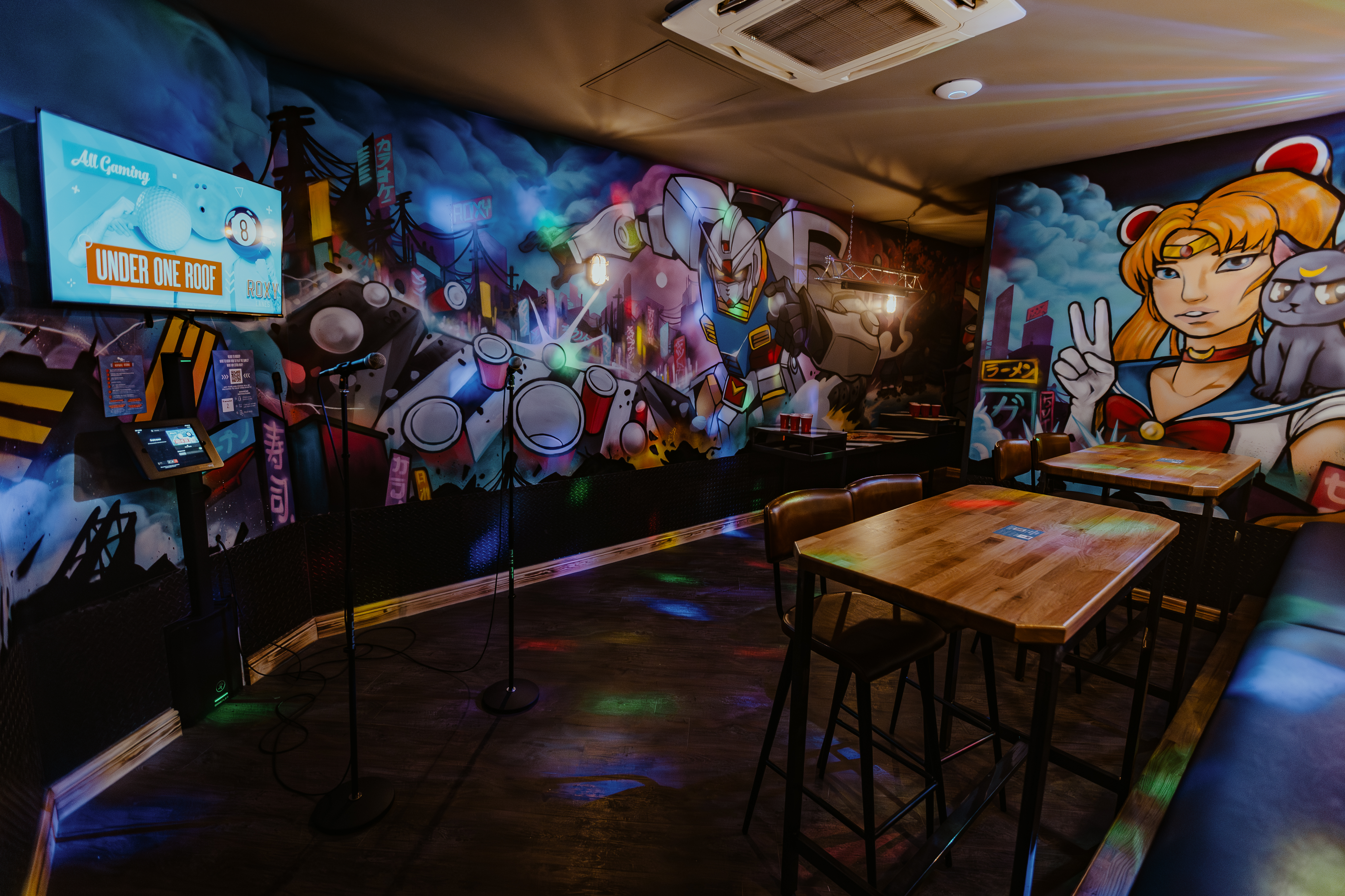 Karaoke Room at Roxy Lanes, vibrant mural art for creative workshops and networking.