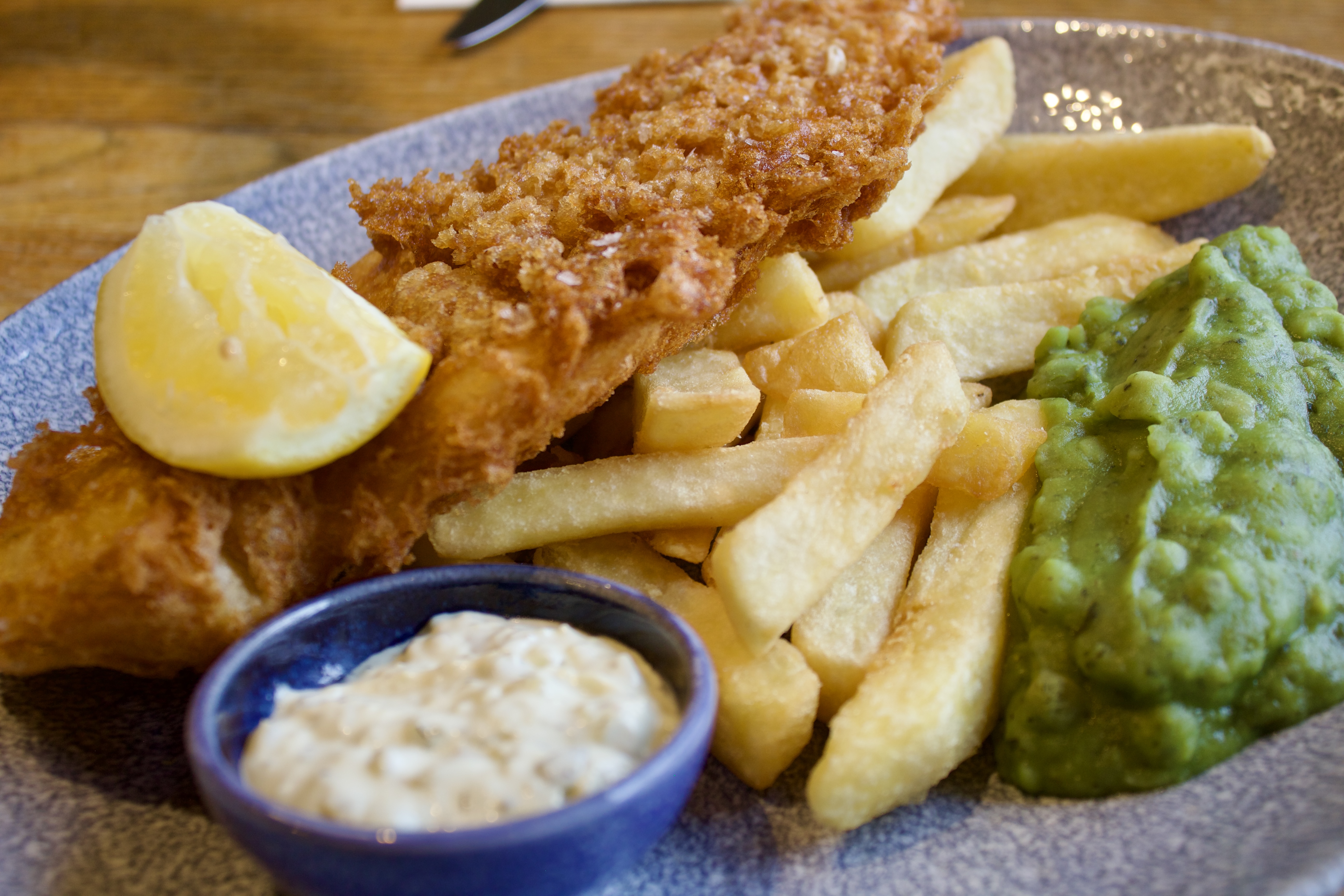 Crispy fish and chips at The Library, perfect for casual dining events and networking.