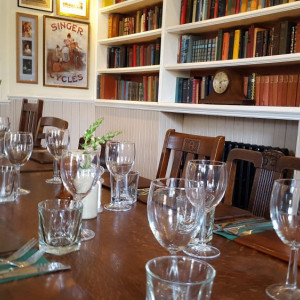 Elegant meeting space with wooden table, ideal for intimate gatherings or events.