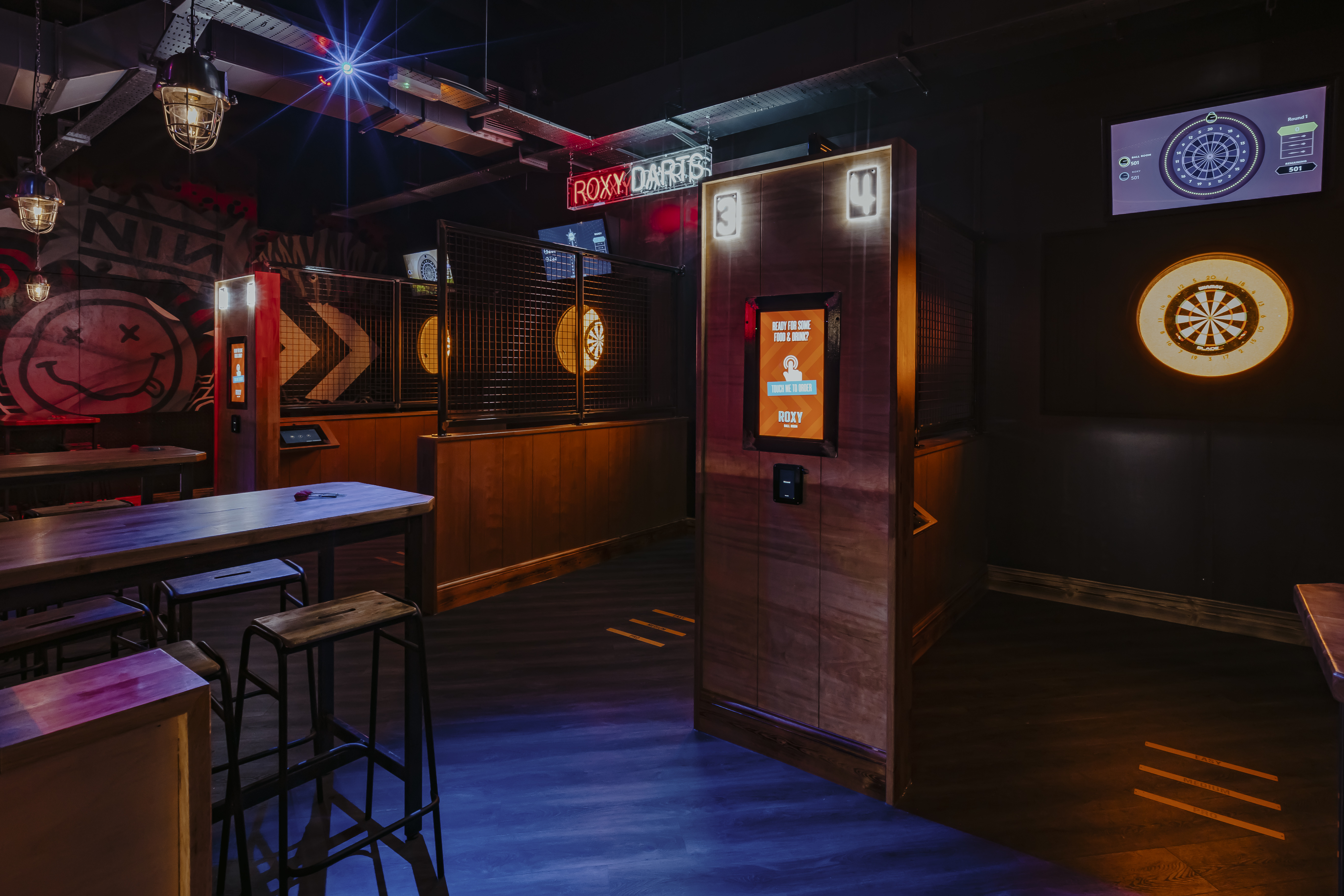 Event space at Roxy Ball Room with dartboards for networking and team-building.