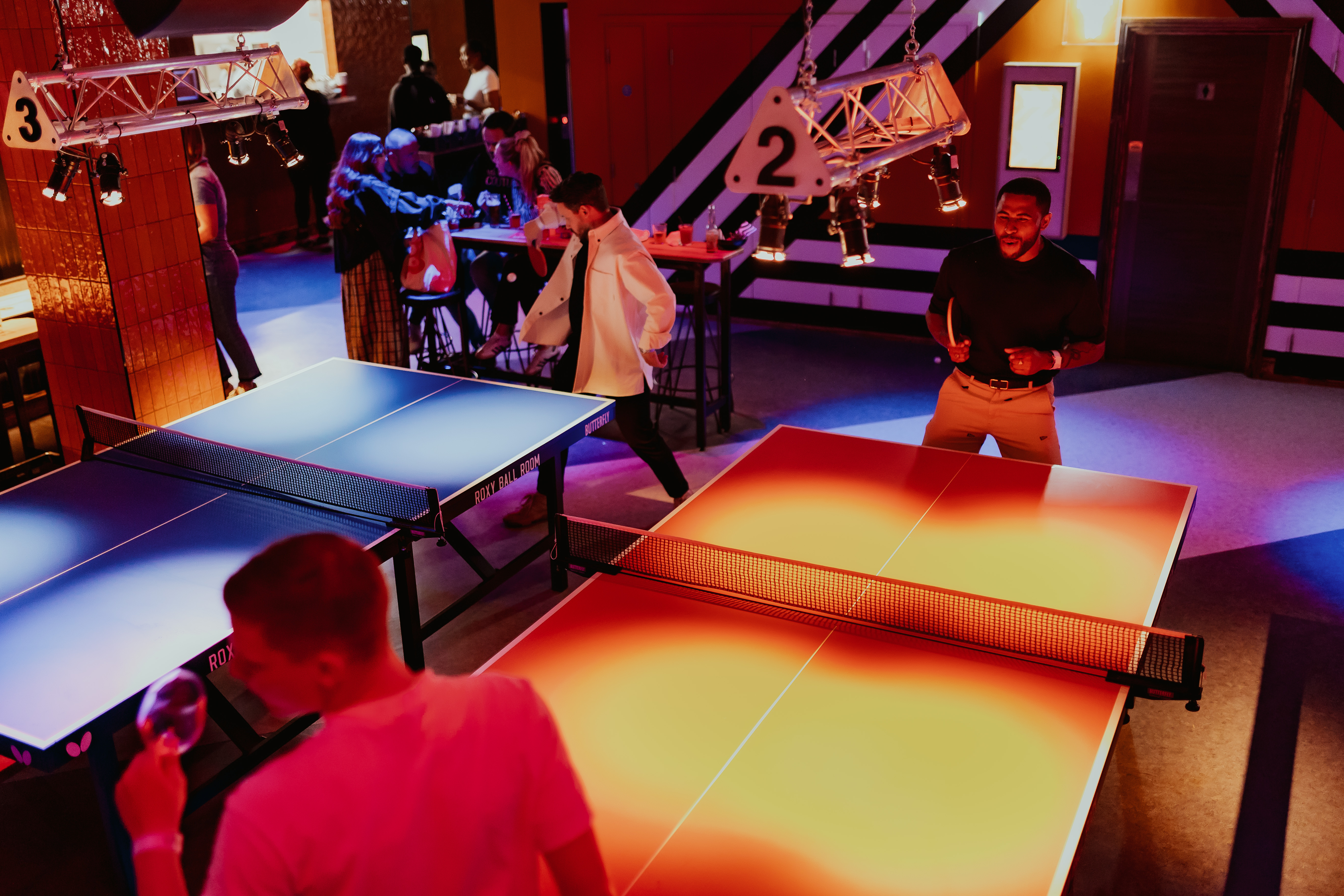 "Roxy Ball Room tournament area with table tennis for lively team-building events"