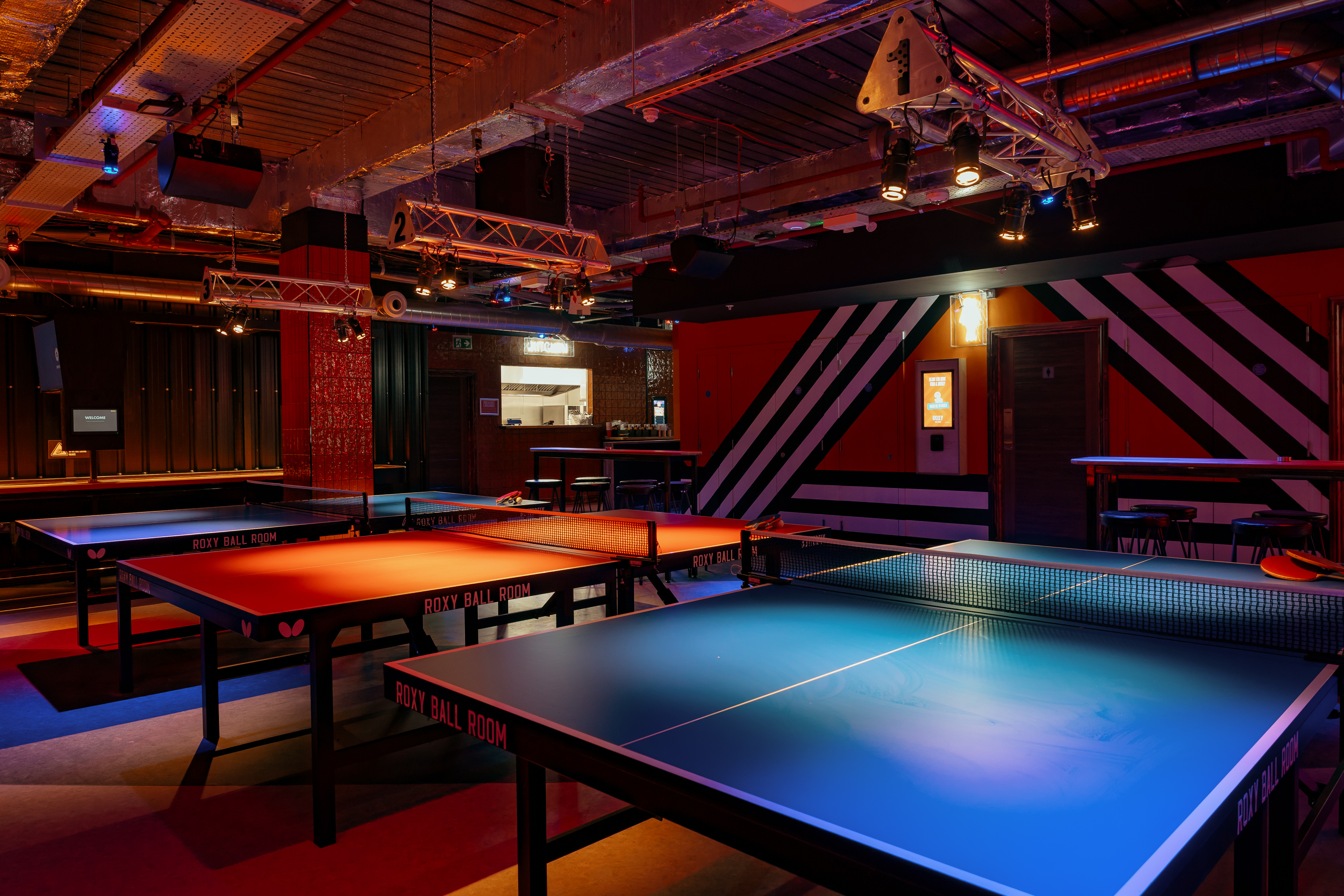 Roxy Ball Room tournament area in London with illuminated ping pong tables for events