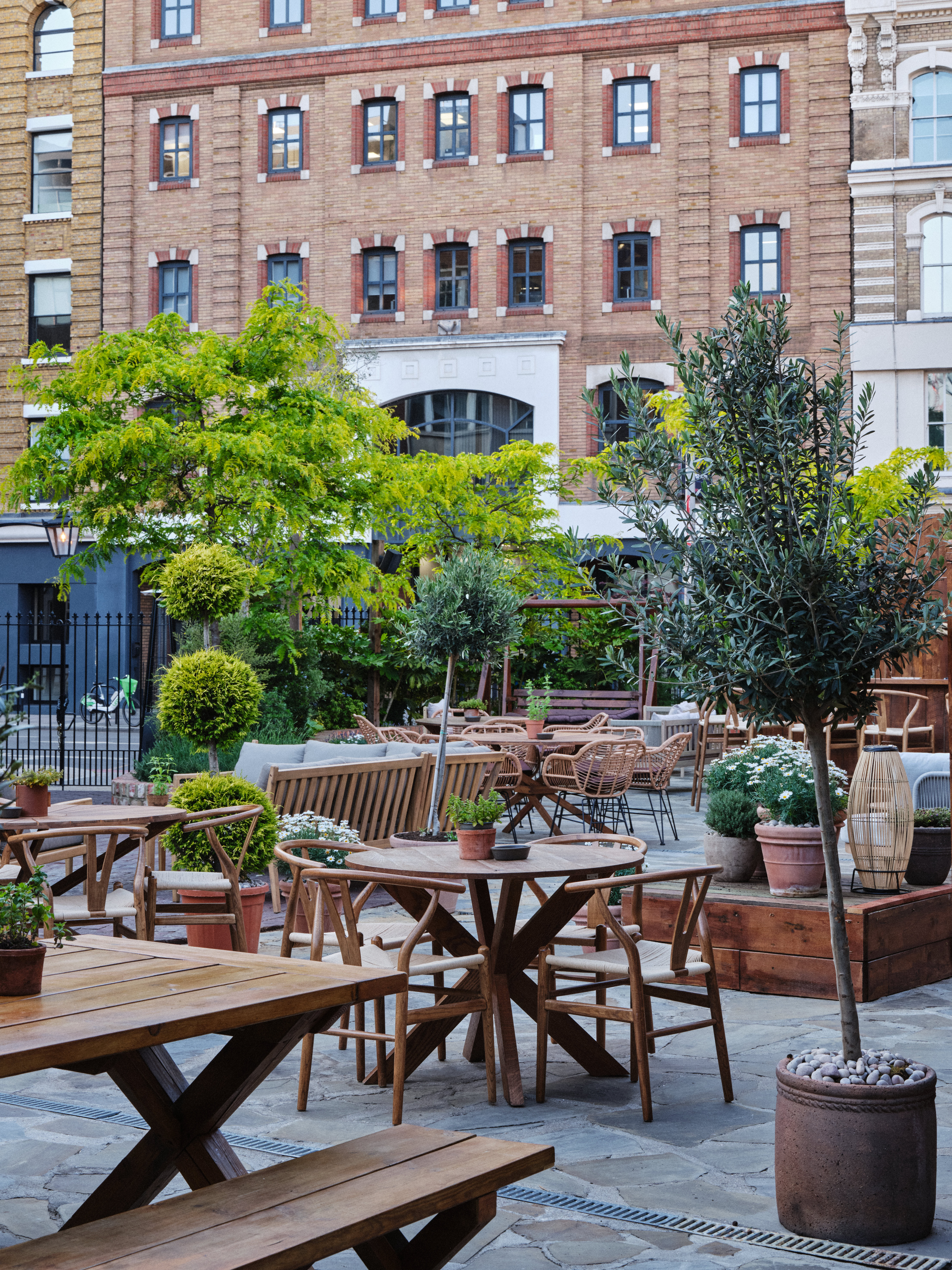 Charming outdoor venue with rustic furniture for casual gatherings and networking events.