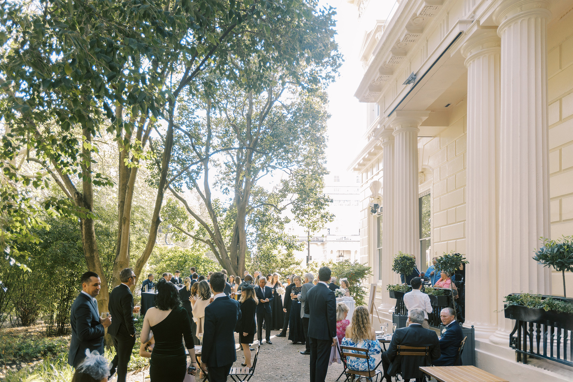 Elegant outdoor wedding at 116 Pall Mall with lush greenery and sophisticated ambiance.