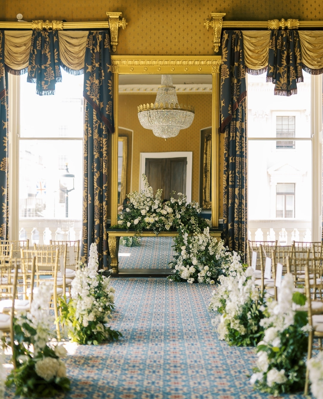 Elegant wedding venue at 116 Pall Mall with floral arrangements and chandeliers.