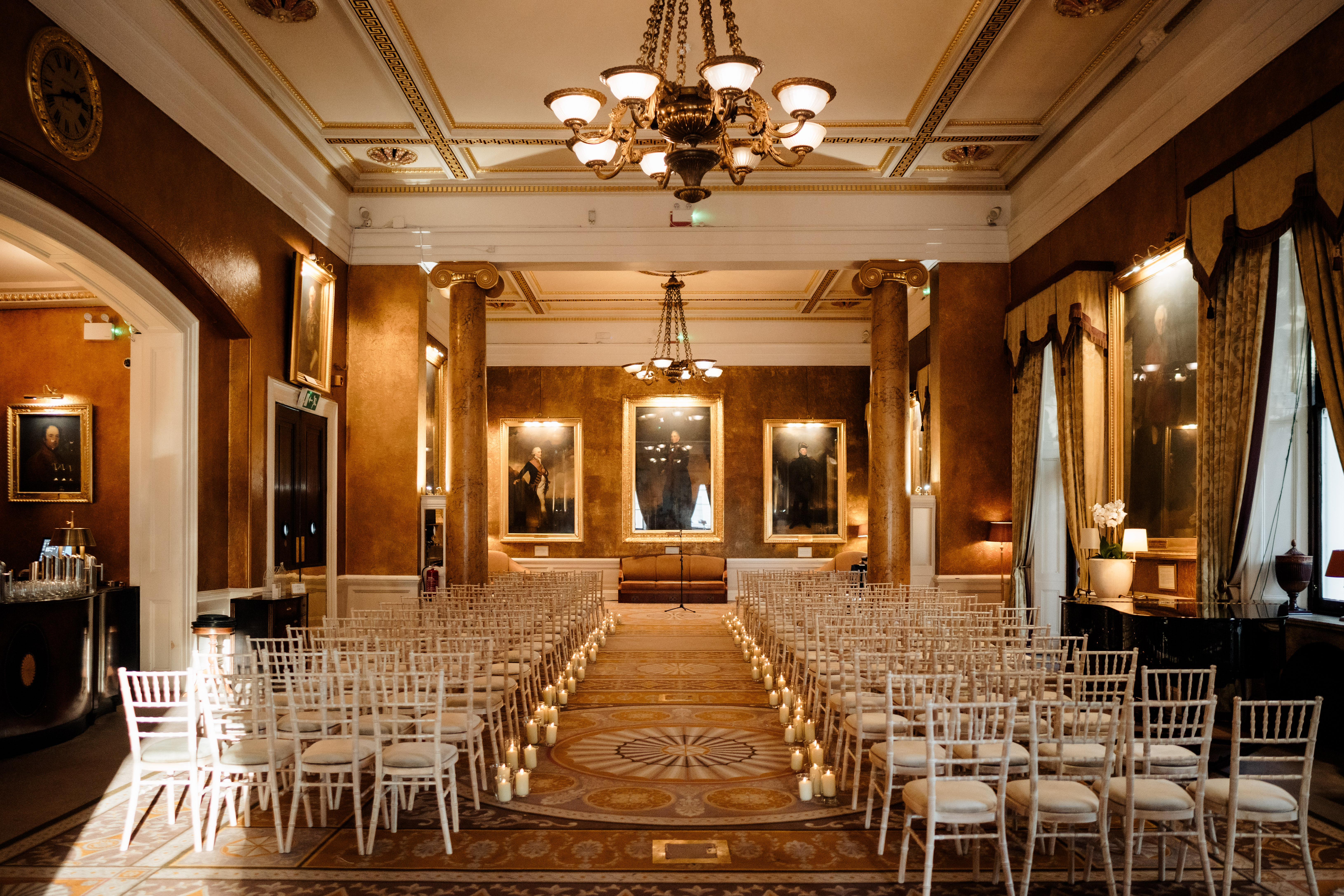 Elegant wedding venue at 116 Pall Mall with ornate chandeliers and upscale decor.