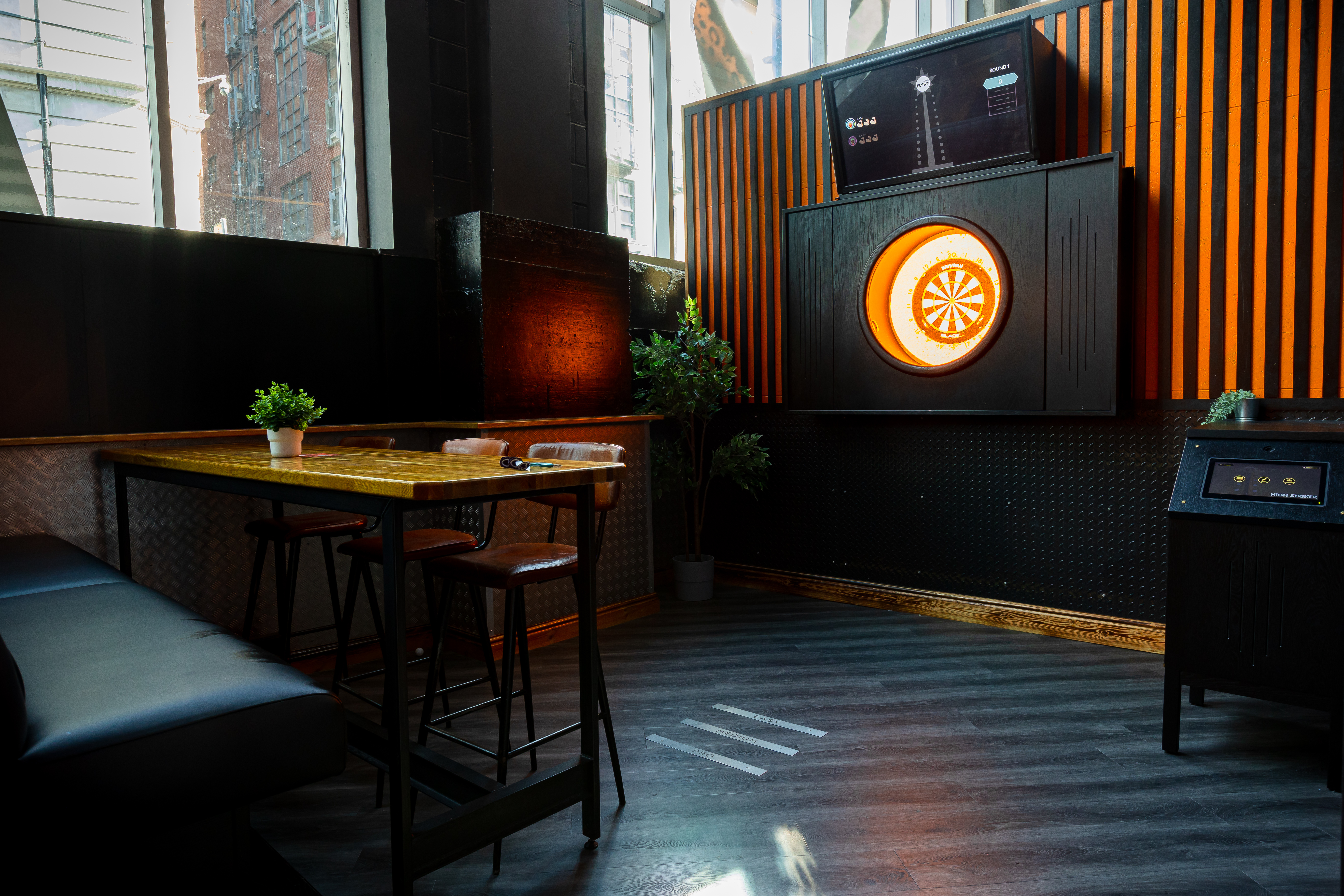 Bullseye Zone at Roxy Ball Room Manchester: darts gaming area for corporate events and team building.