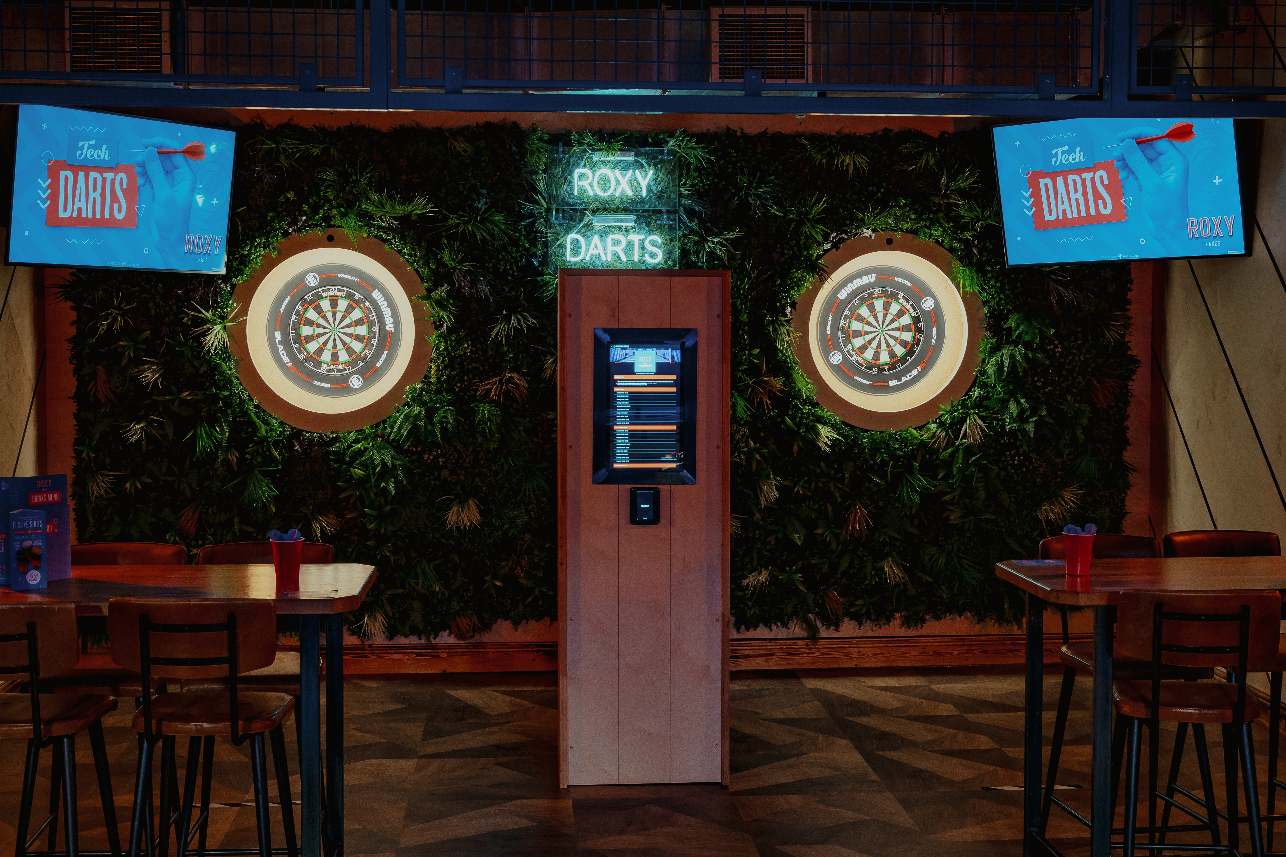 Darts area in Roxy Lanes, Bristol, perfect for social events and team-building activities.