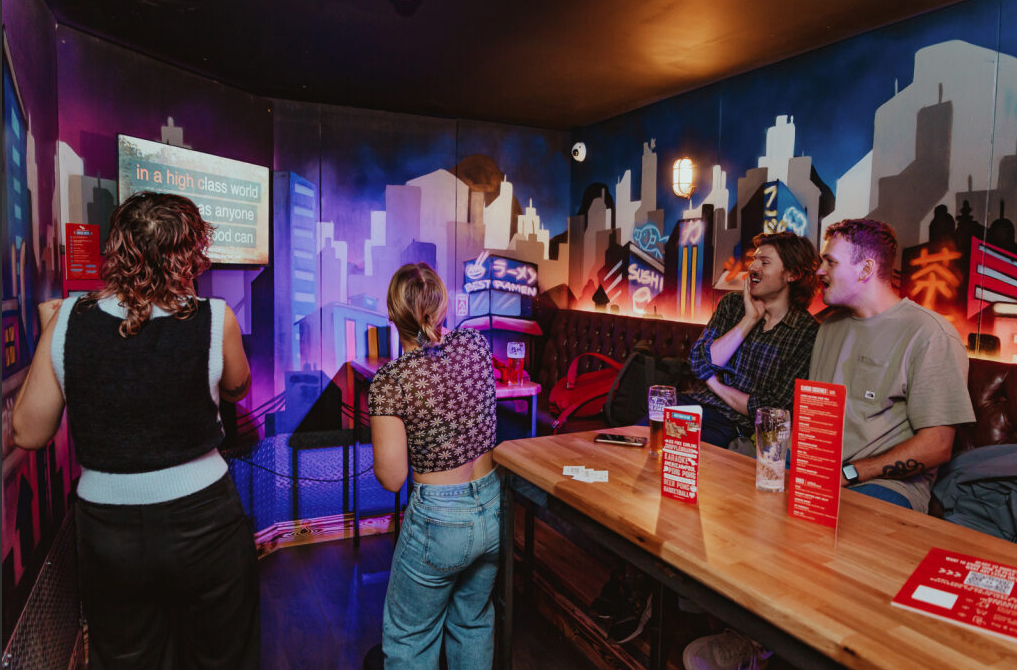 Lively karaoke private event at Roxy Ball Room, urban-themed backdrop in Sheffield.