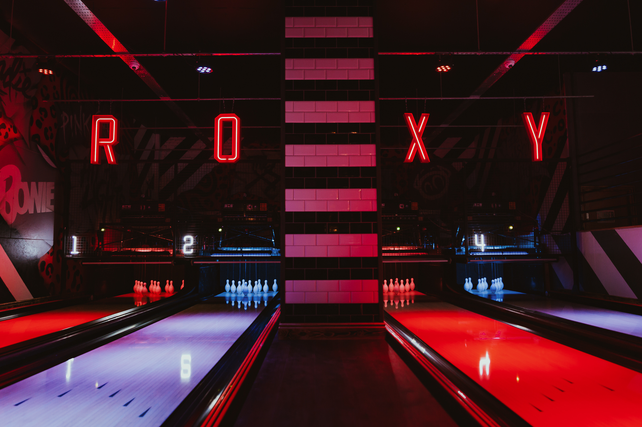 Vibrant Roxy Bowling Alley in Sheffield with neon lights, perfect for corporate events.