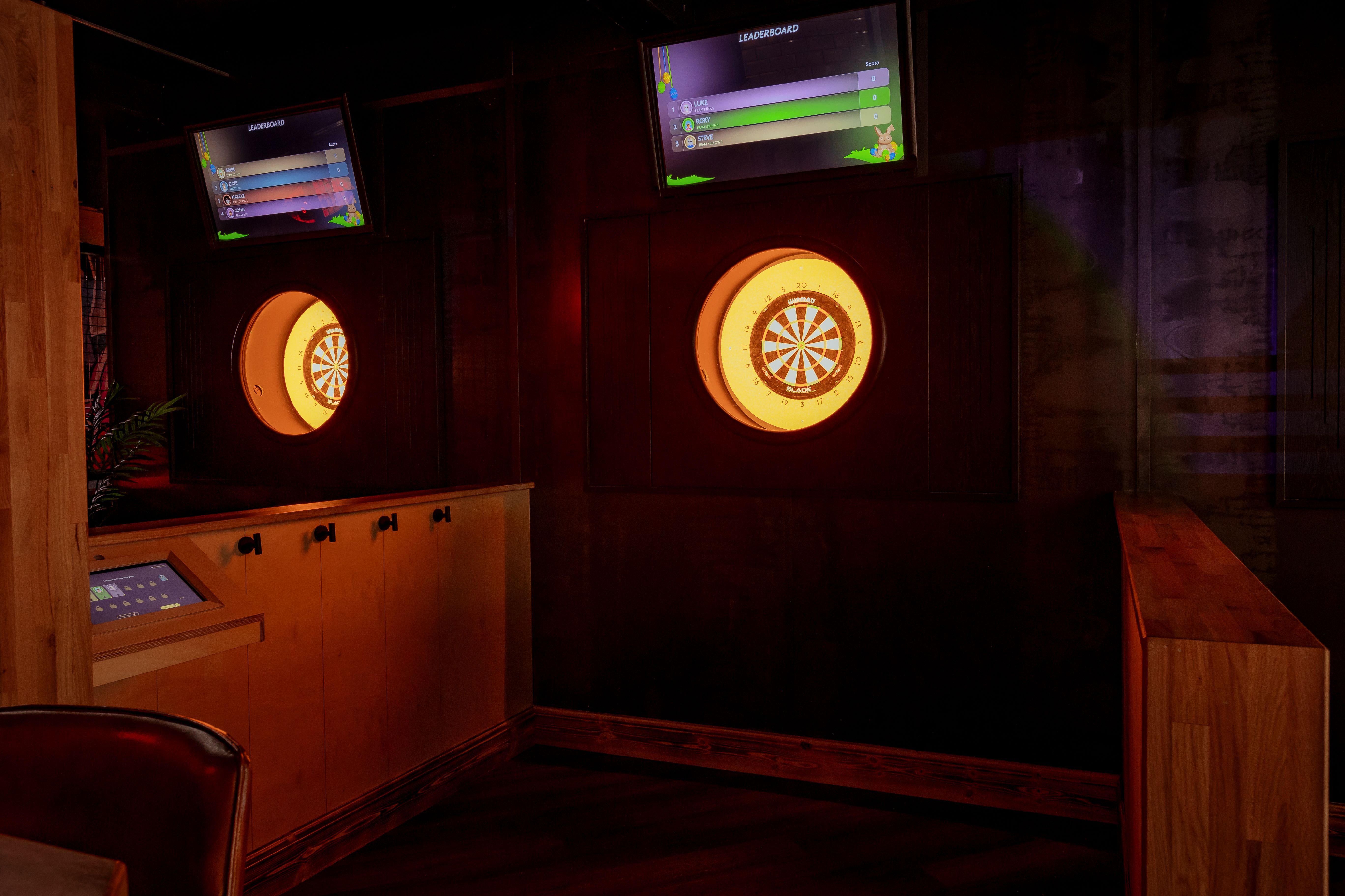 Vibrant dartboard setup at The Bullseye Zone for team-building events in Cardiff.