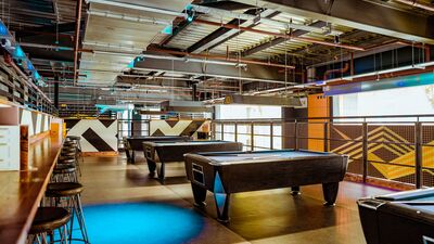 Pool area with pool tables at King Pins, Trafford Palazzo for casual events and networking.