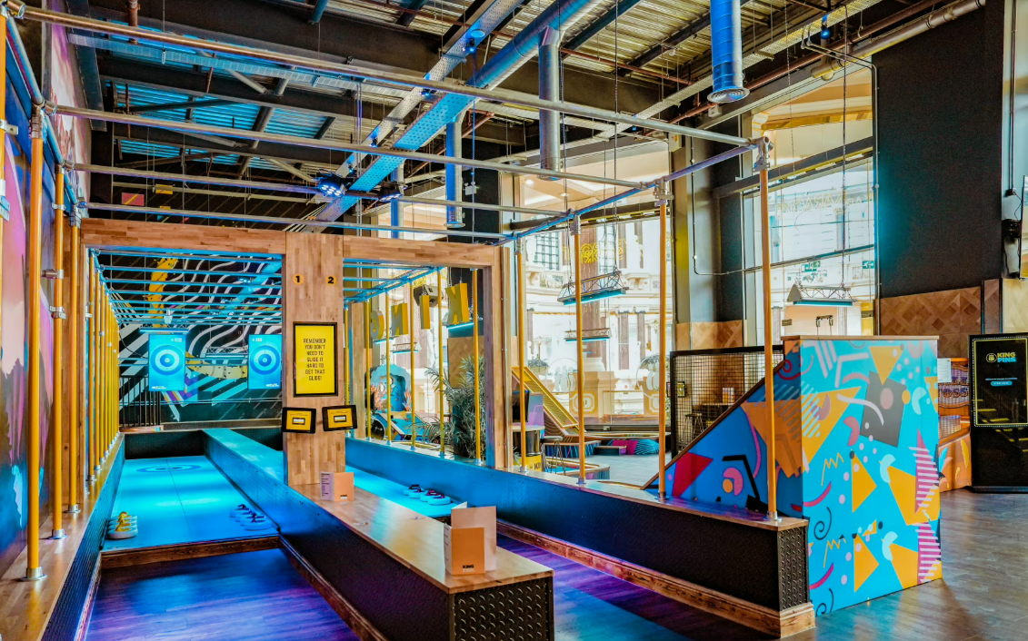 Colorful event space with bowling lanes for team-building and networking in Manchester.