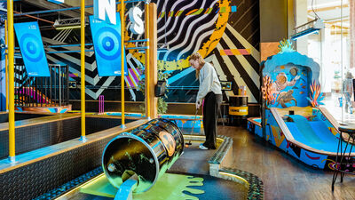 Vibrant mini-golf venue for team-building and social events in Manchester.