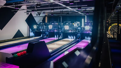 Vibrant bowling alley at King Pins, Manchester for corporate events and team-building fun.