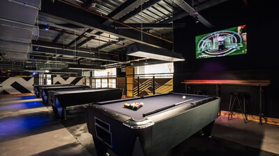 The Mezzanine at King Pins: stylish venue with pool tables for networking events.