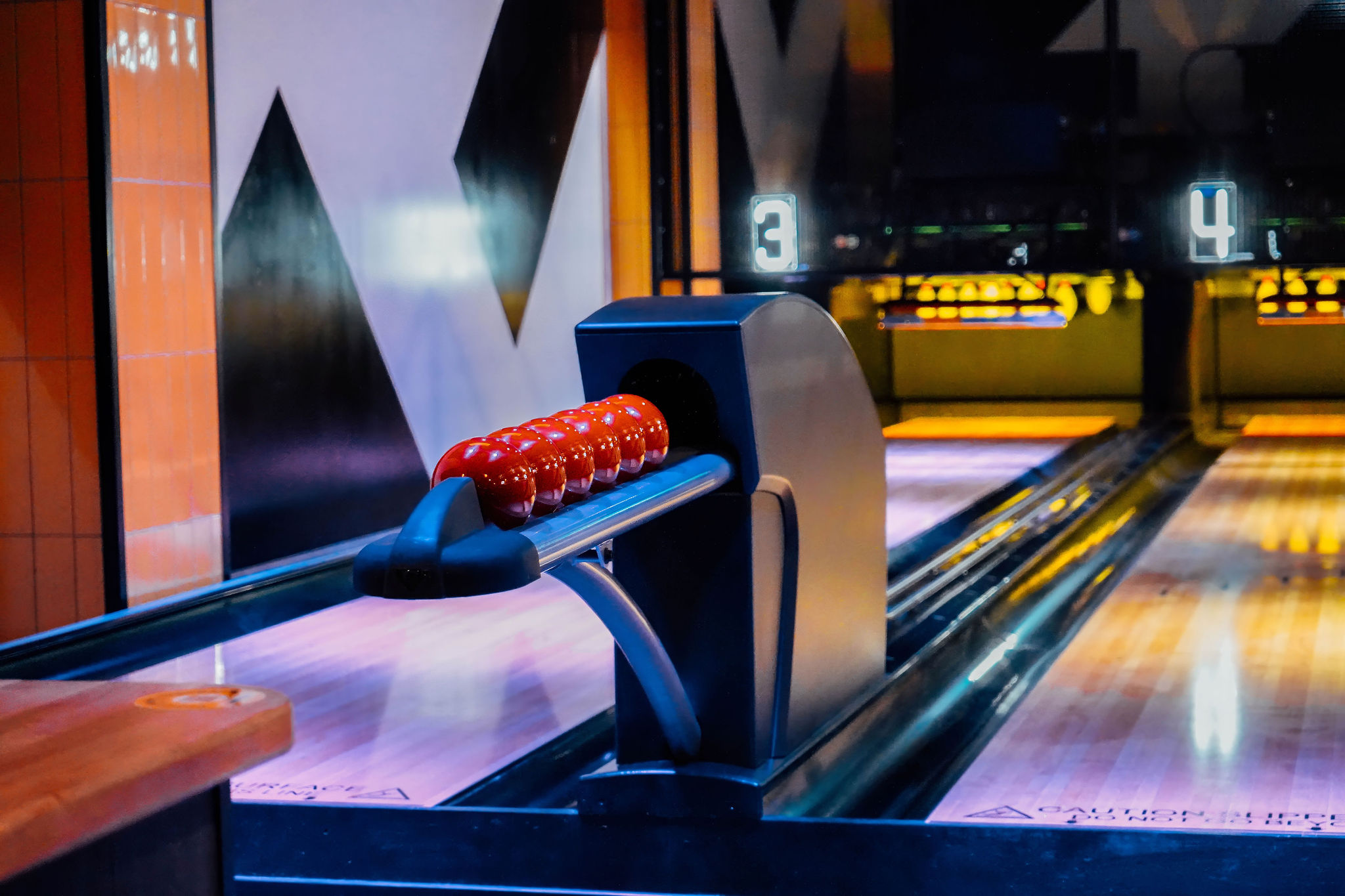 Vibrant bowling alley in King Pins Manchester for fun team-building events.