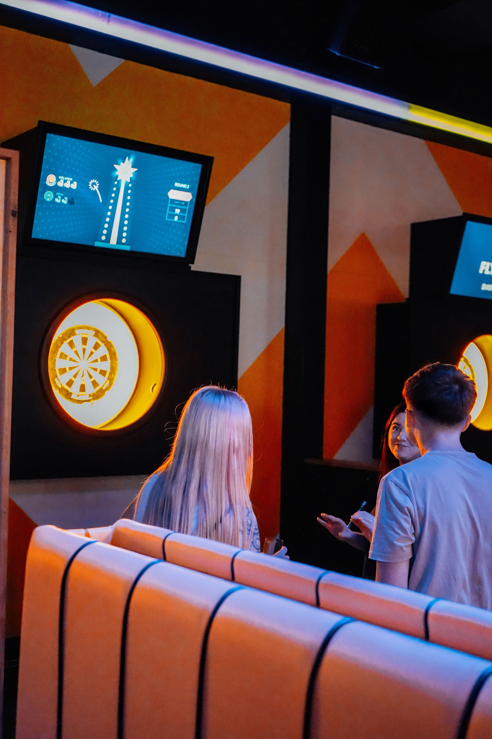 The Bullseye Zone at King Pins in Manchester, vibrant dartboard decor for events.