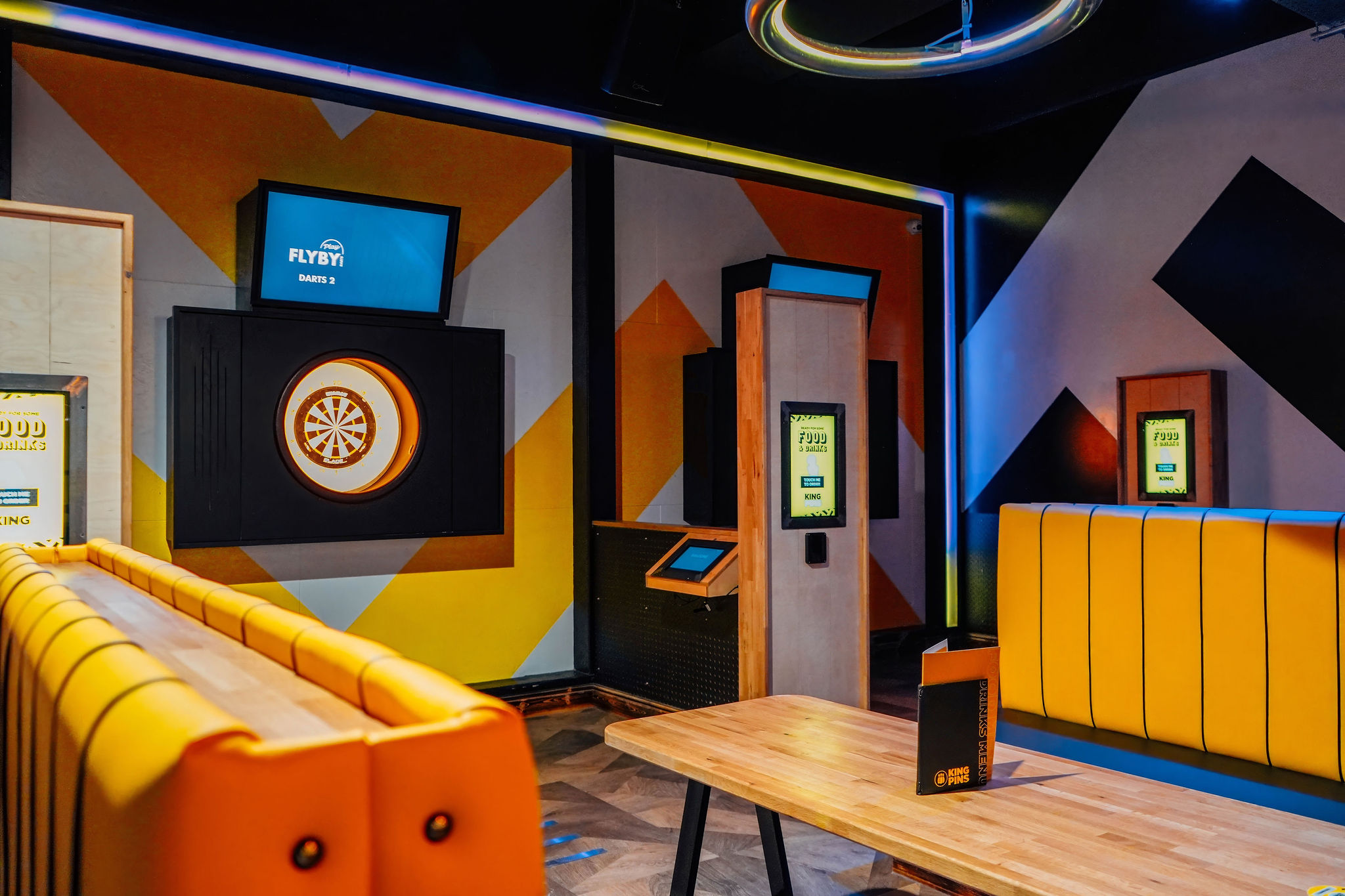 Modern event space at King Pins, Arndale Manchester with dart boards for corporate gatherings.