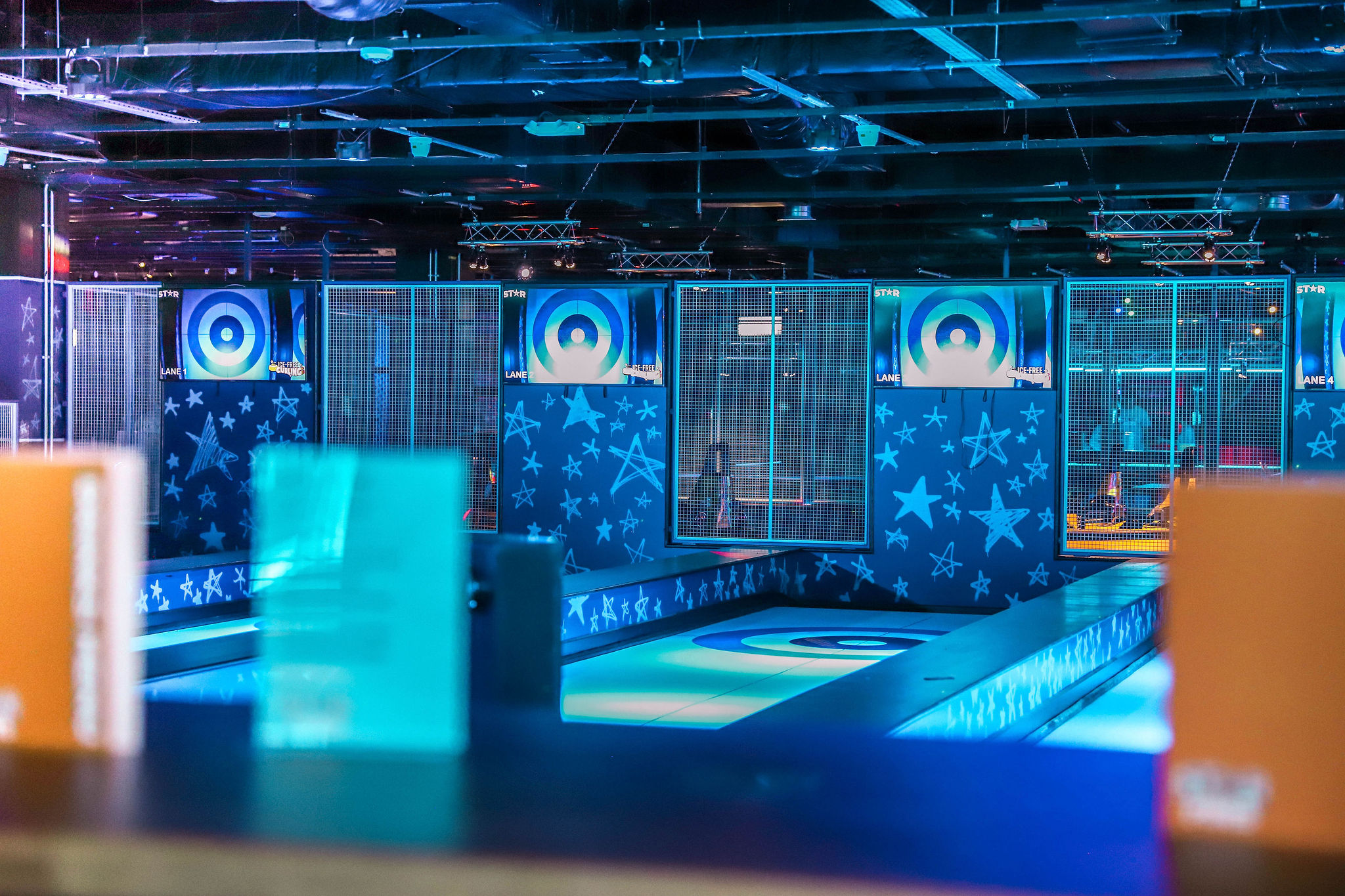 Strike and Slide venue in Coventry with colorful lighting for team-building events.