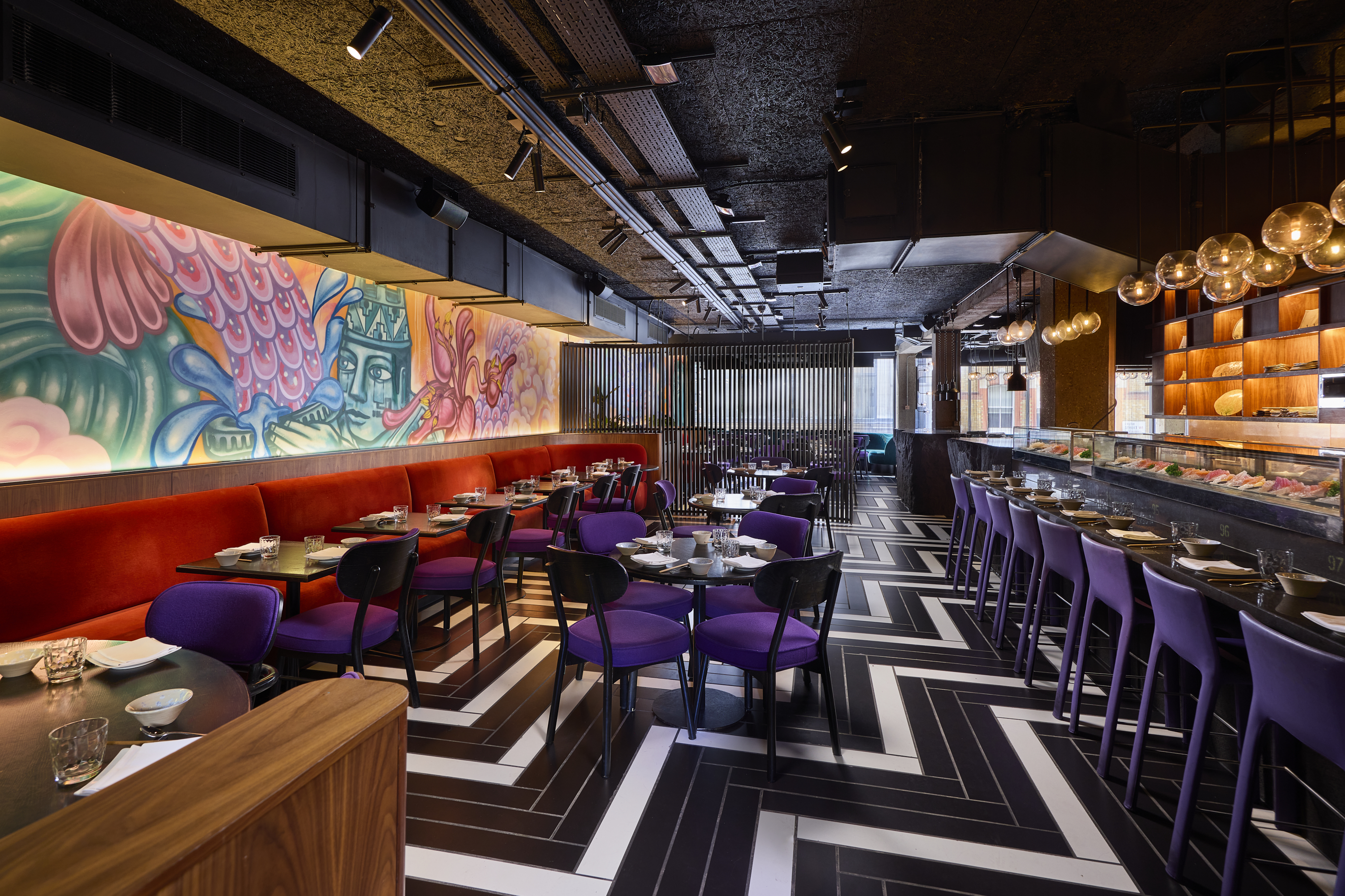 Stylish Itamae restaurant with vibrant mural, ideal for events and gatherings.