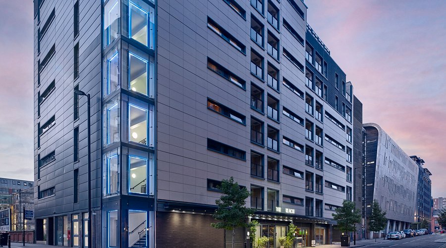 Modern event venue with glass architecture in Manchester for meetings and gatherings.