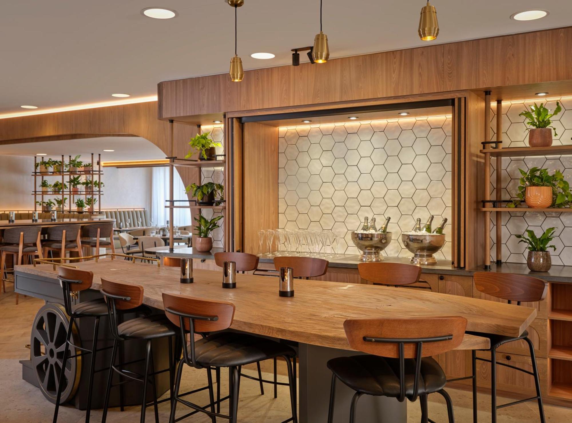 Stylish event space with wooden bar at The Reach, Piccadilly Manchester for upscale meetings.