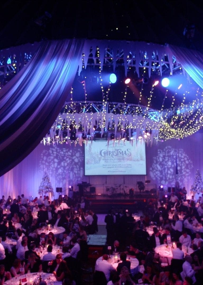 Elegant Main Hall event space for Christmas celebration with festive decor and lighting.