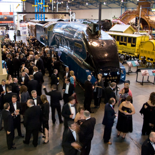 Networking event in Great Hall, National Railway Museum; upscale gala ambiance.