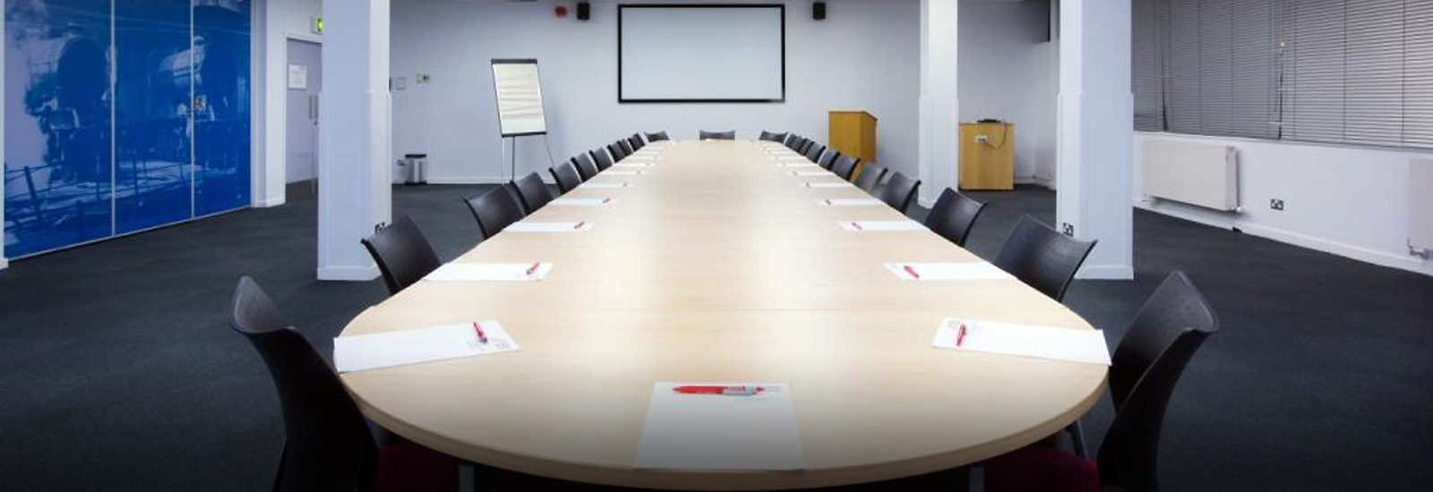 Mallard Suite meeting room with oval table, perfect for collaboration and presentations.