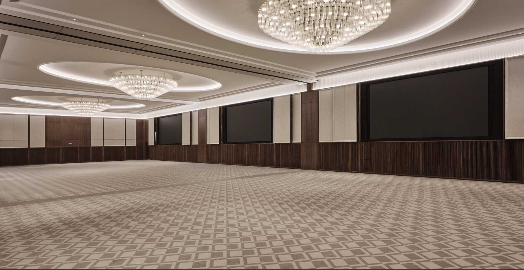 Elegant Grand Ballroom with modern chandeliers for corporate events and receptions.