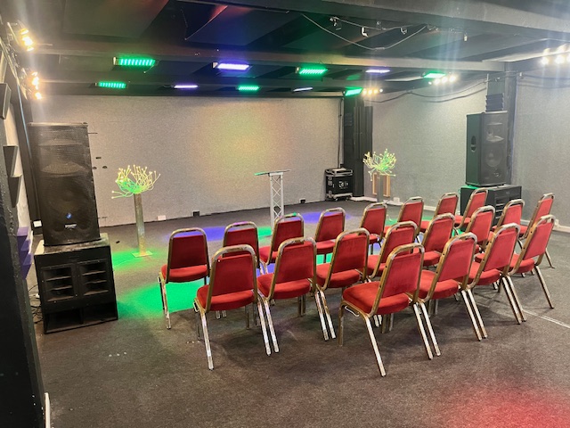 Premier Room 3 at Robannas Studios, featuring red chairs for presentations and seminars.