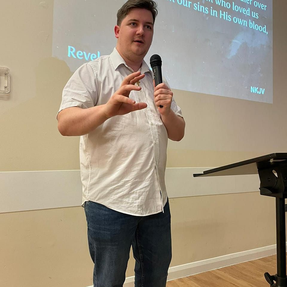 Speaker with microphone at Connect Centre event, professional presentation and seminar.