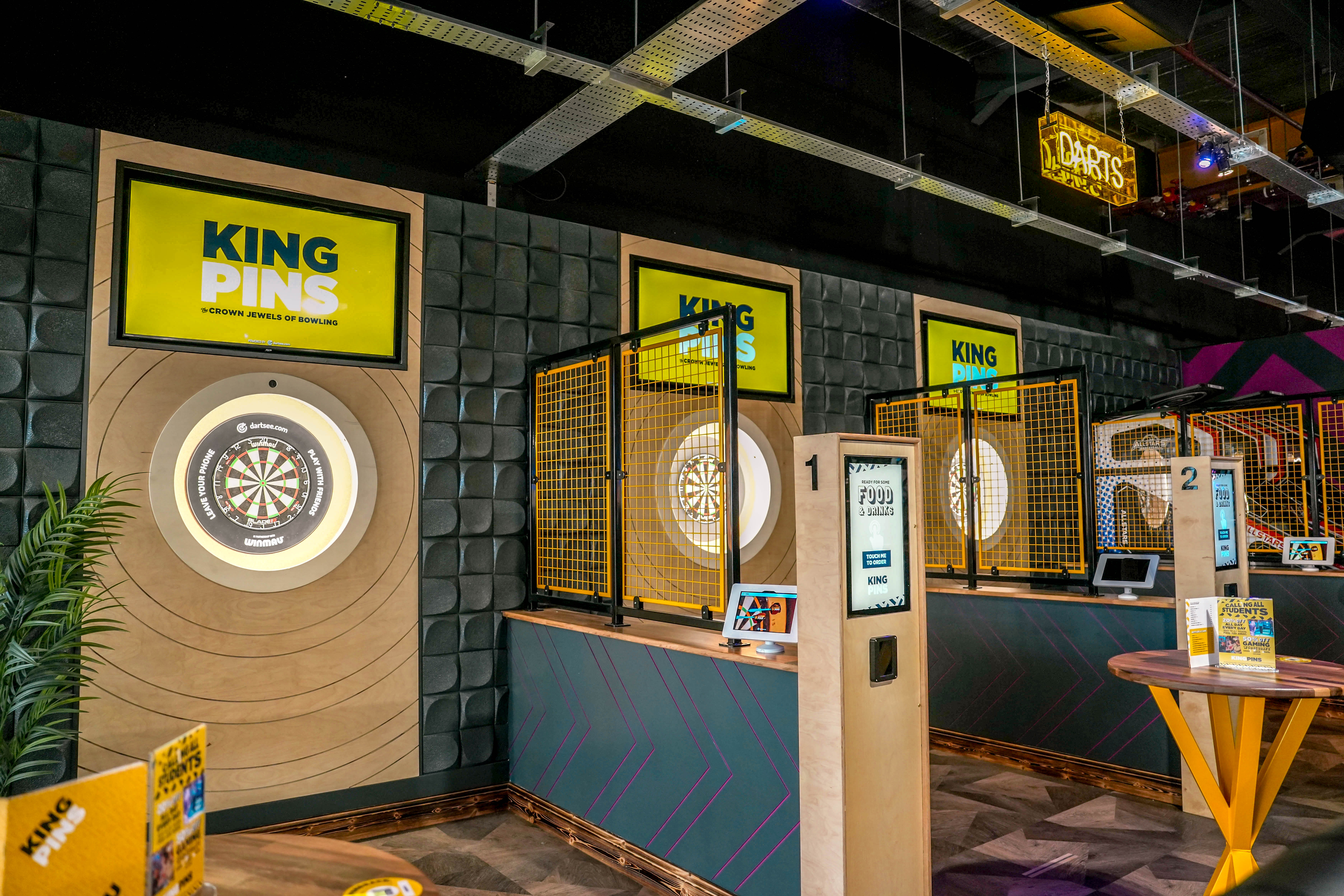 Bullseye Zone at King Pins Leeds, vibrant dart lanes for team-building events.