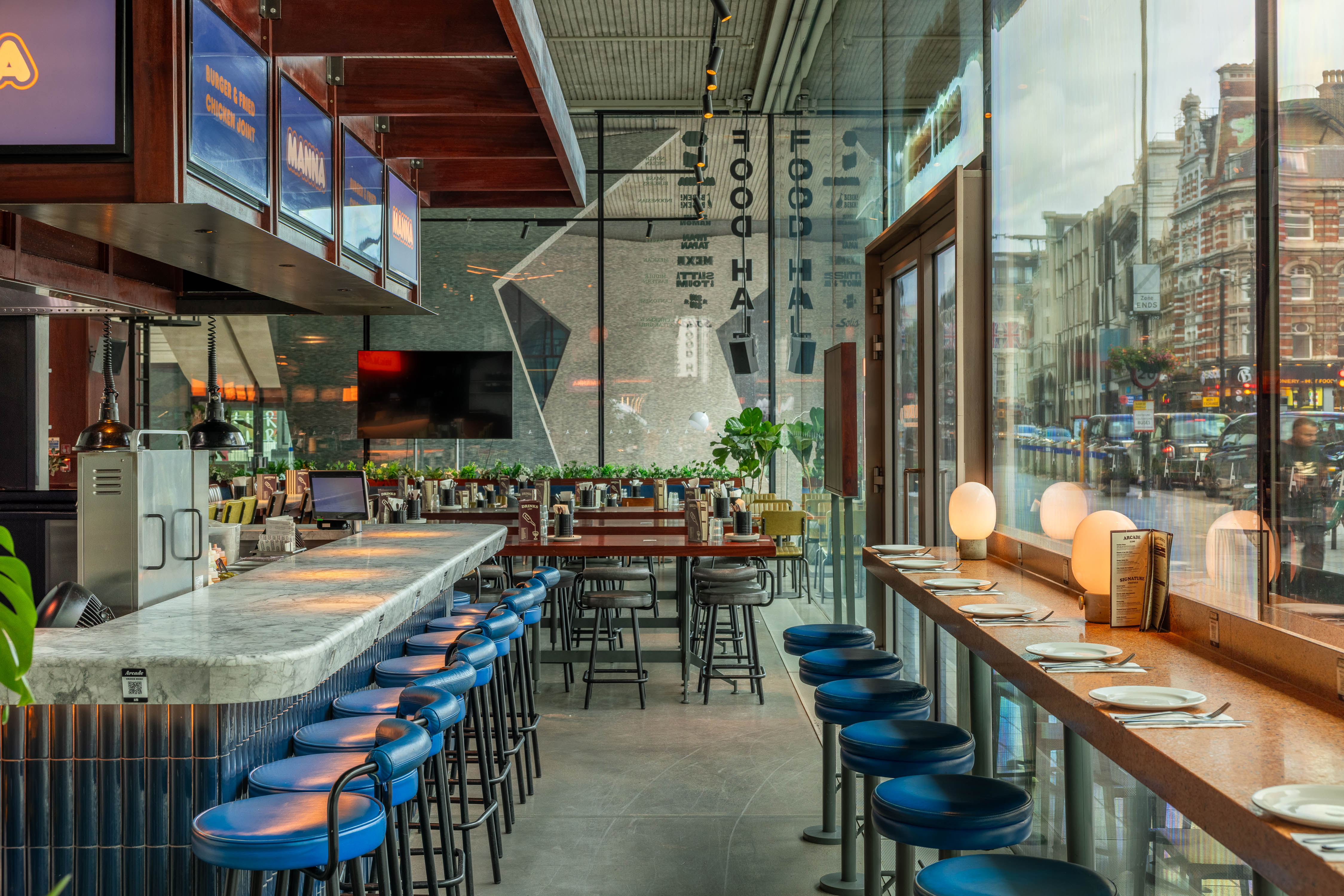 Modern restaurant with vibrant ambiance, ideal for casual meetings and networking events.