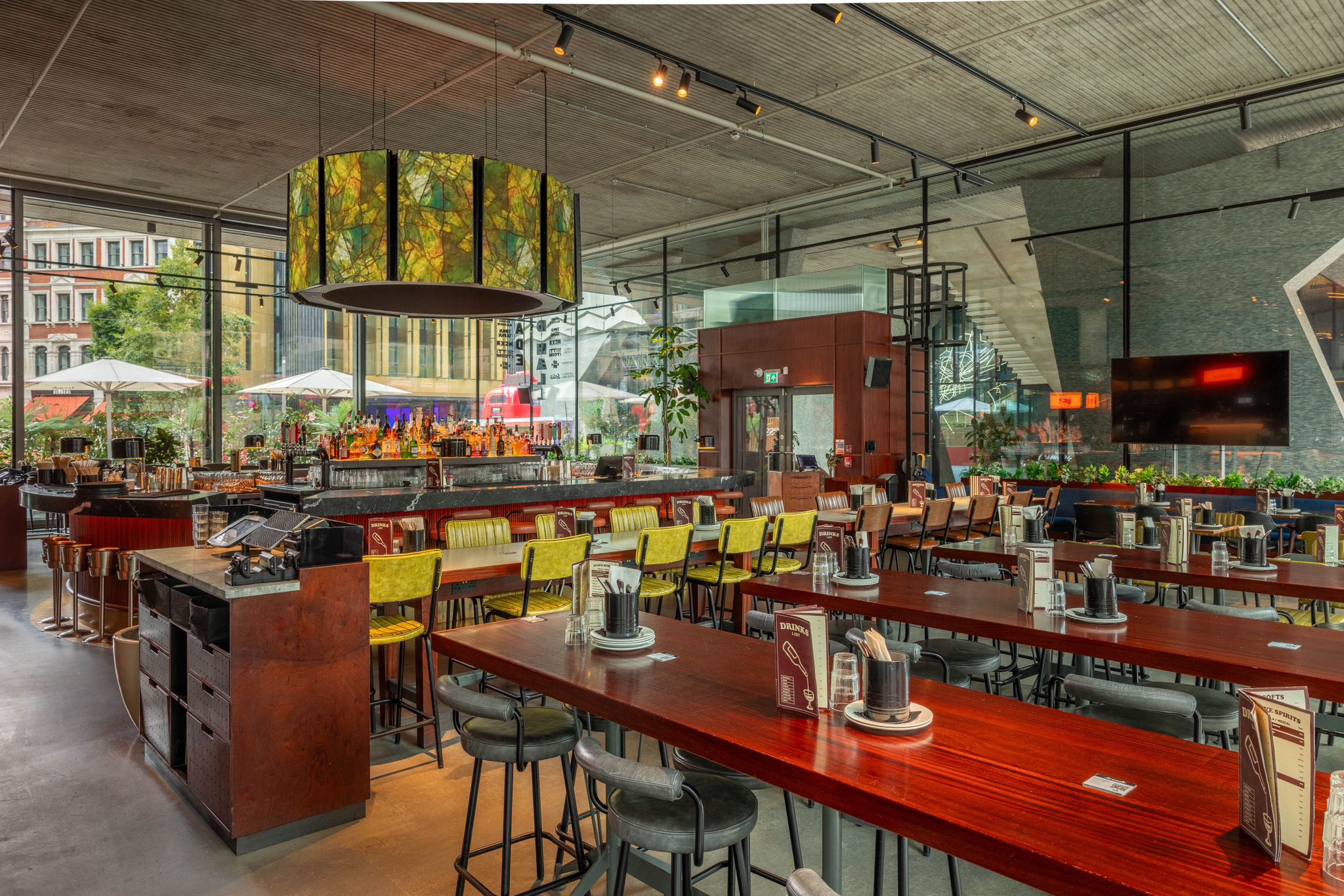 Modern restaurant venue with communal tables for meetings and events at Arcade Tottenham Court Road.