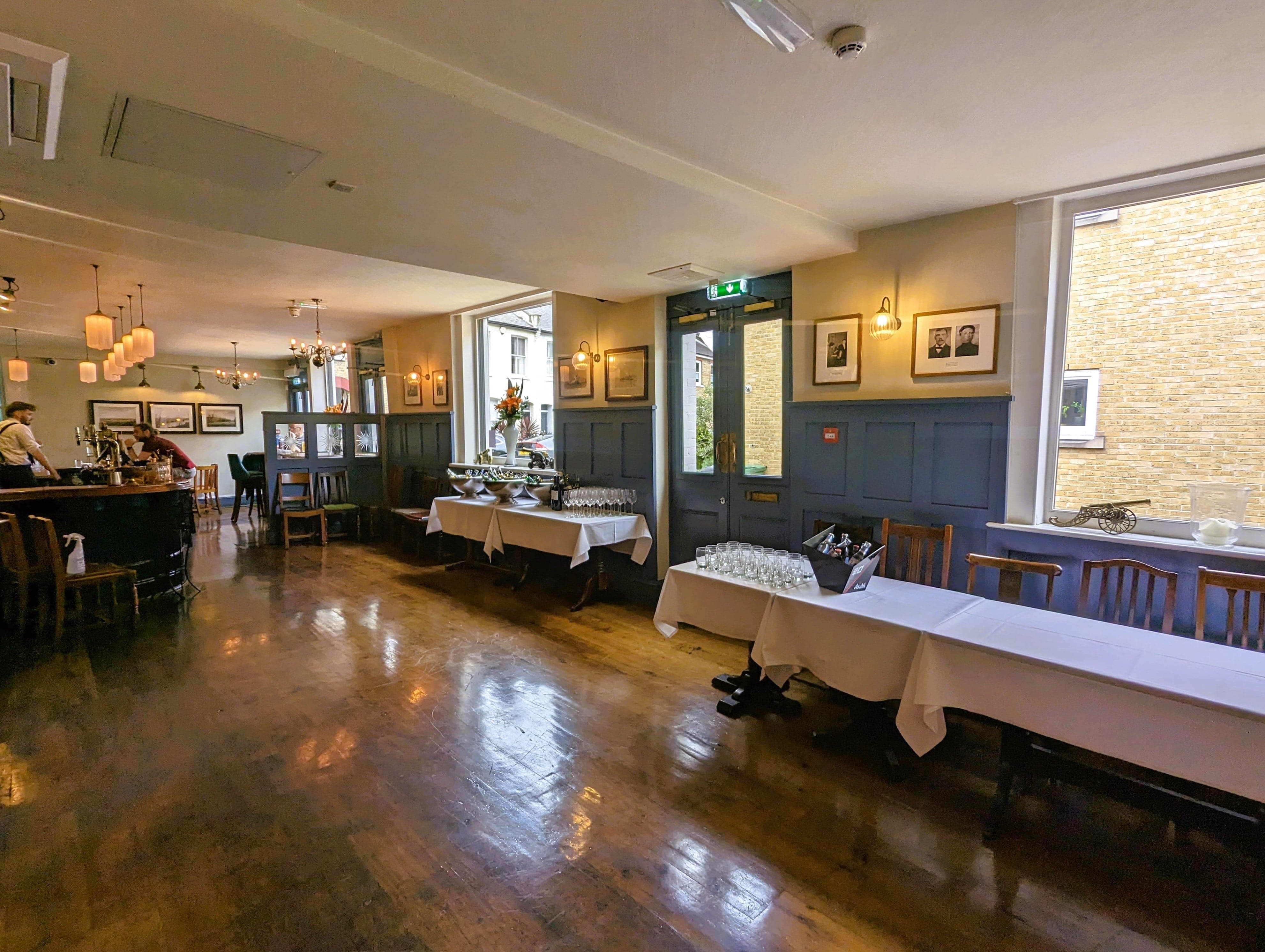 Elegant dining room in The Gun, ideal for events and gatherings with natural light.