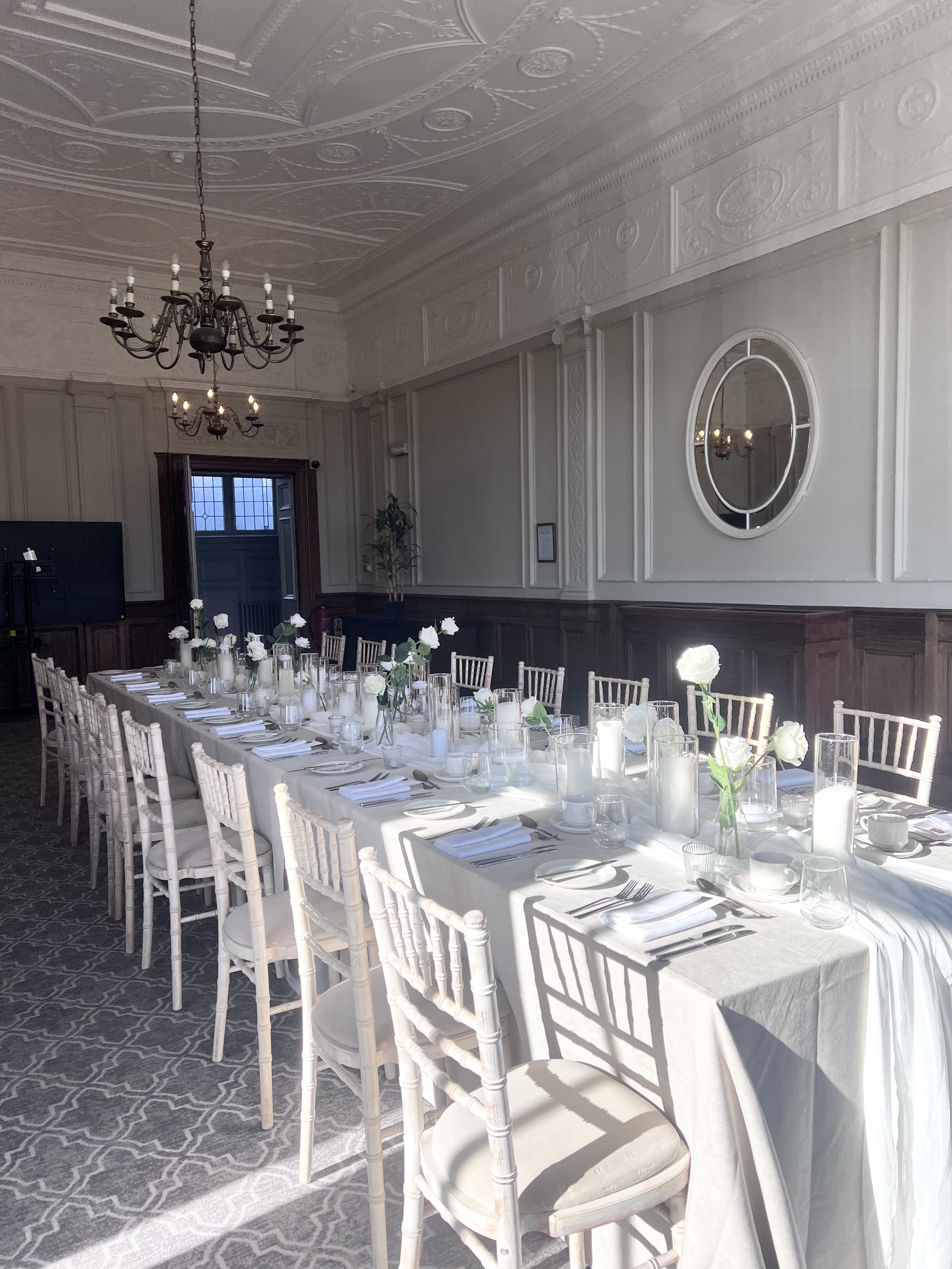 Elegant dining table with white flowers in Wedgewood, The Milner York event space.