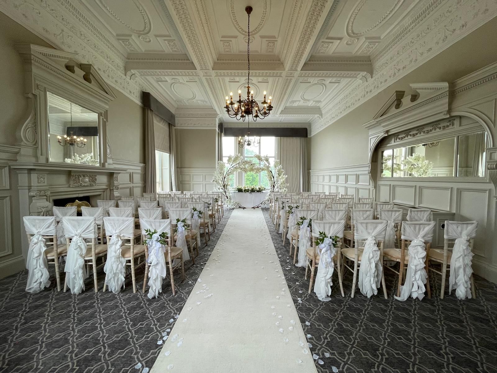 Elegant wedding venue at The Milner York with white-draped chairs and romantic decor.