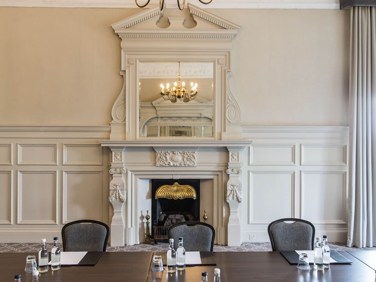 Elegant meeting room with fireplace at The Milner York for intimate gatherings.