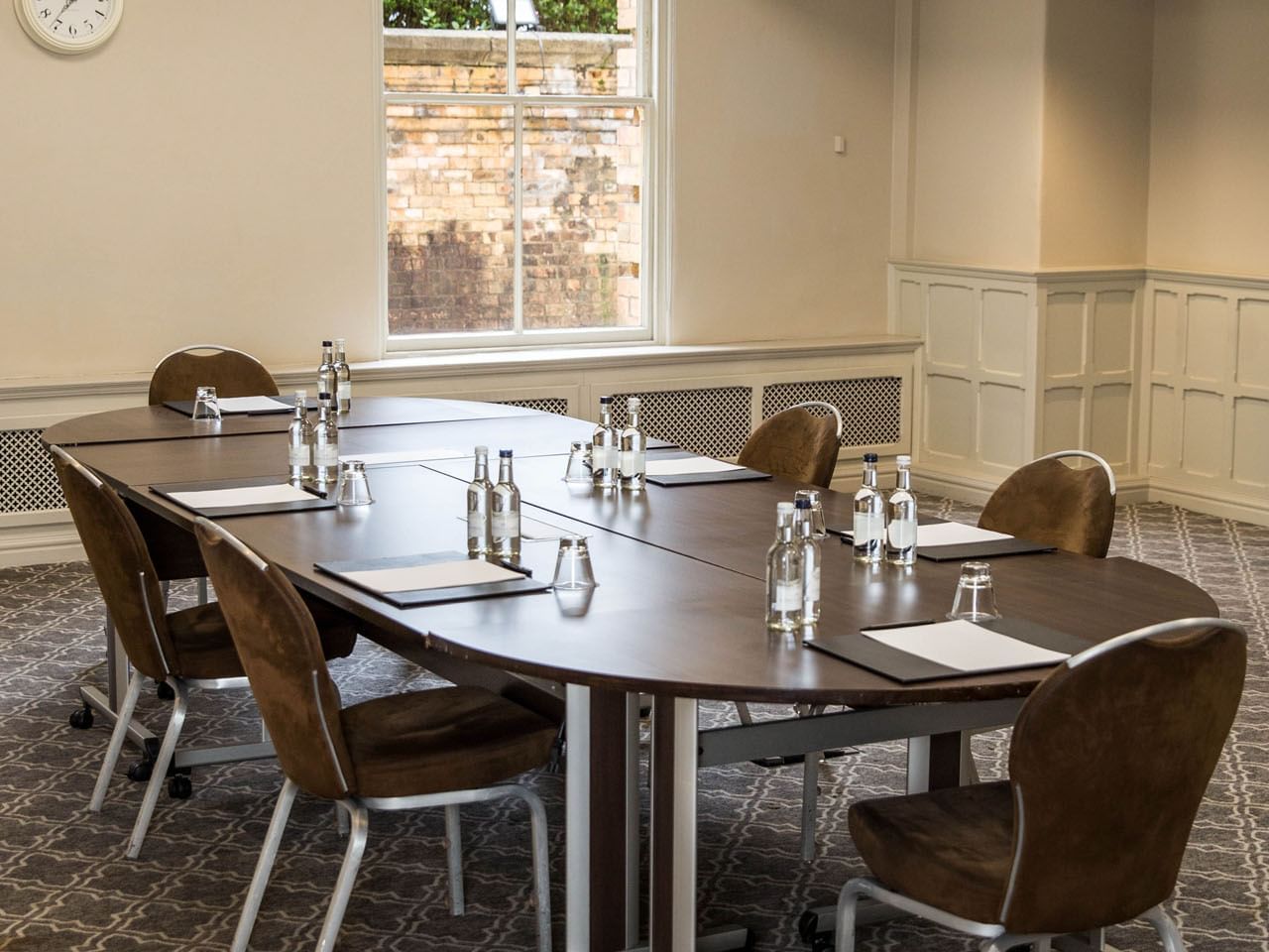 Elegant meeting room at Jorvik, featuring an oval table and natural light for events.