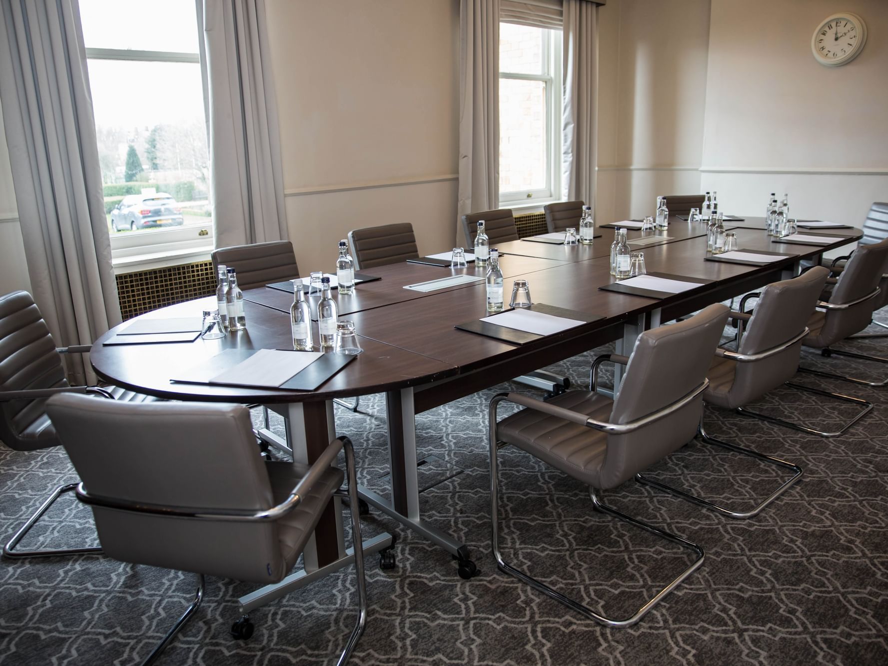 "Boardroom at The Milner York with polished table, ideal for corporate meetings and gatherings."