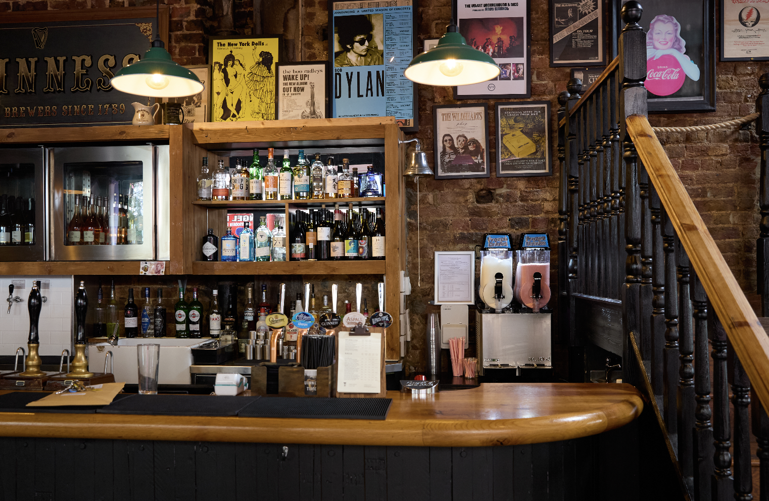 Inviting bar setup with vintage decor for casual networking events at The Islington Townhouse.