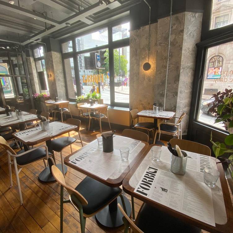 Forbici restaurant venue with floor-to-ceiling windows for networking and team lunch events.