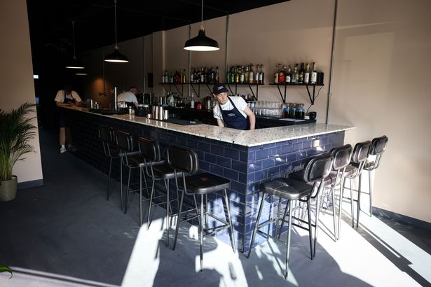 Tiled bar at Finders Keepers: stylish industrial breakout space for conference mixers and events.