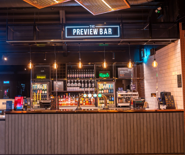 Industrial-chic satellite bar at Vue Glasgow St Enoch for corporate networking and cocktail events.