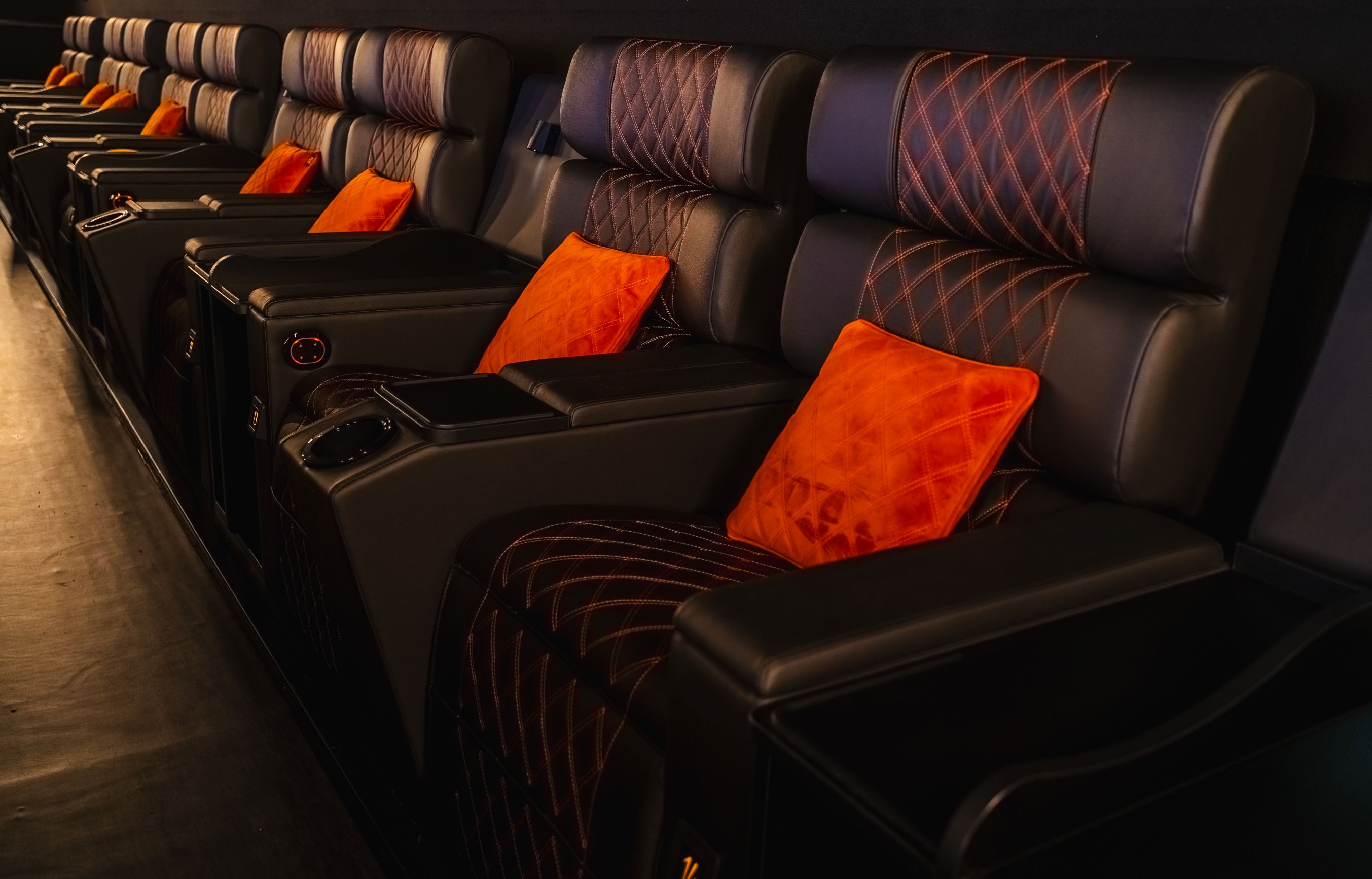 Luxury cinema screen with recliners for corporate events and VIP screenings.